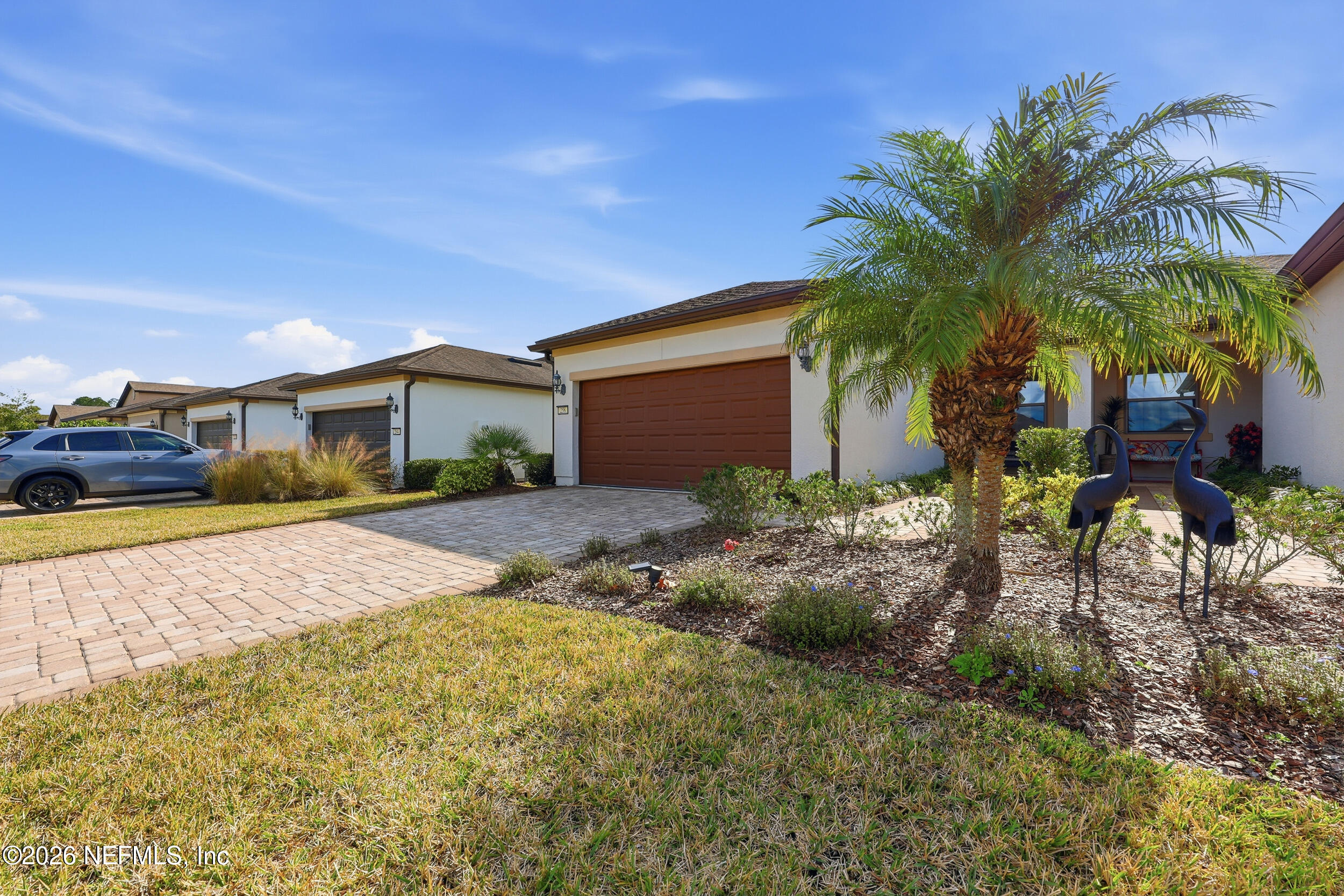 258 Rock Spring Loop St. Augustine, FL 32095 - Photo 31 of 31 a front view of house with yard and trees