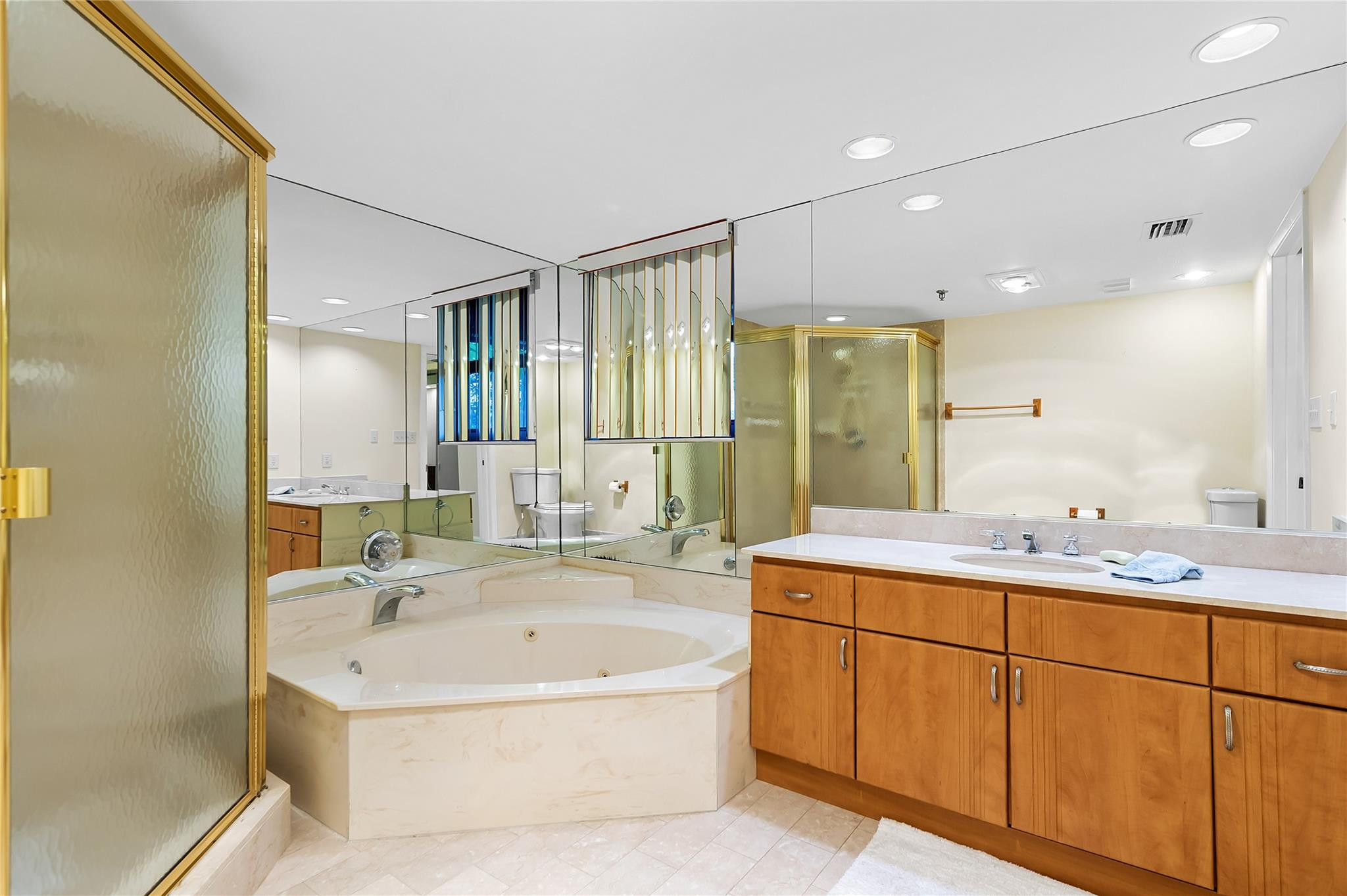 7580 Regency Lakes Drive, Unit 101 Boca Raton, FL 33433 - Photo 23 of 35 2 separate vanities, shower & jetted tub