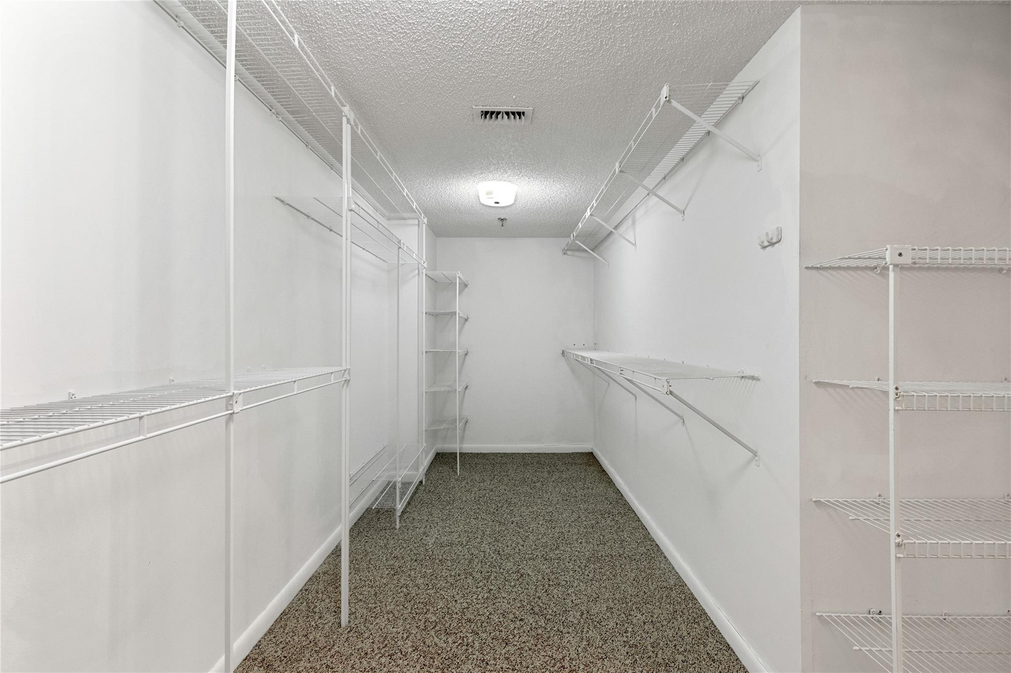 7580 Regency Lakes Drive, Unit 101 Boca Raton, FL 33433 - Photo 24 of 35 Expansive primary closet