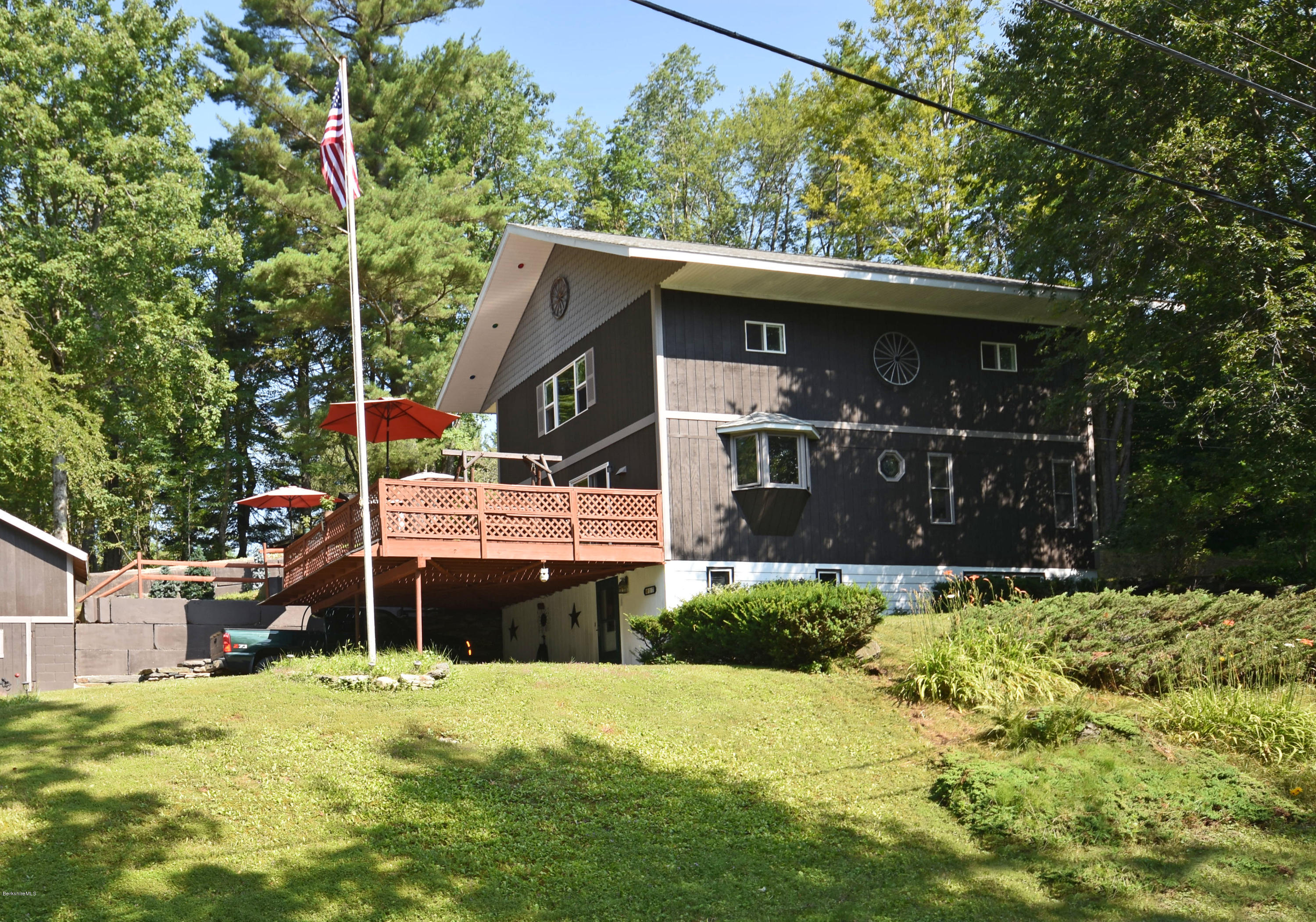 17 Raymond Road Peru, MA 01235 - Photo 1 of 57 a front view of a house with a yard