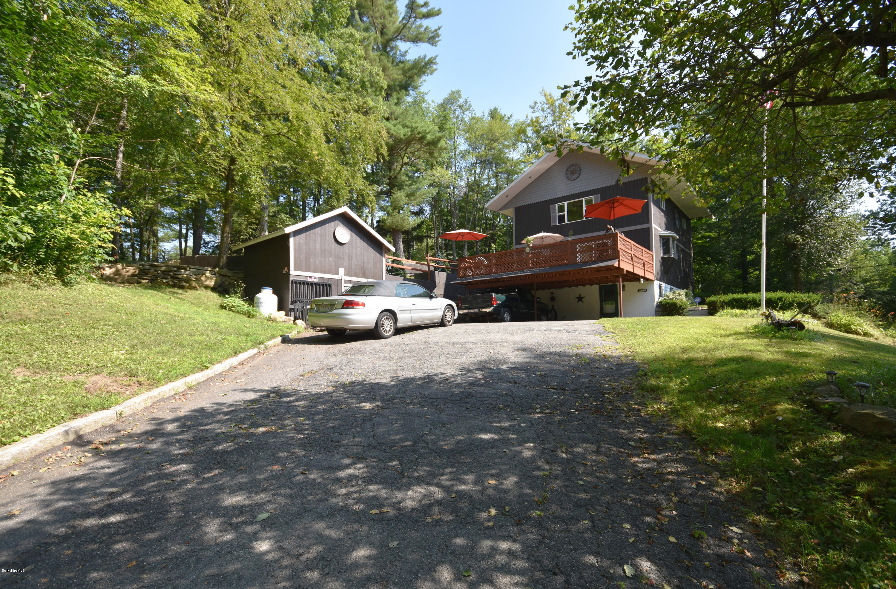 17 Raymond Road Peru, MA 01235 - Photo 3 of 57 a front view of a house with a yard and garage