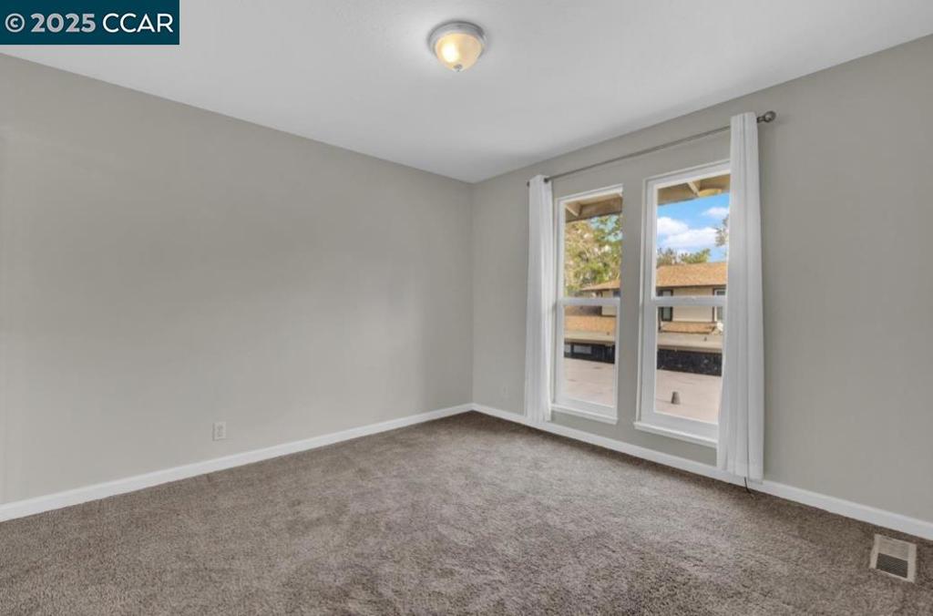 5434 Roundtree Court Concord, CA 94521 - Photo 18 of 23 an empty room with a empty space and windows
