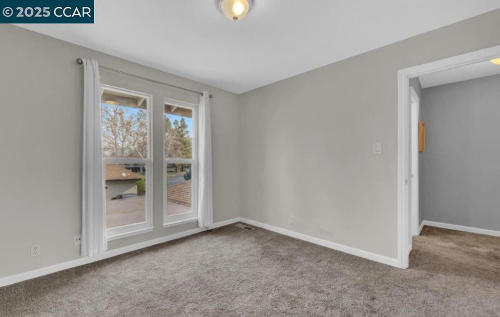 5434 Roundtree Court Concord, CA 94521 - Photo 19 of 23 a view of an empty room with a window