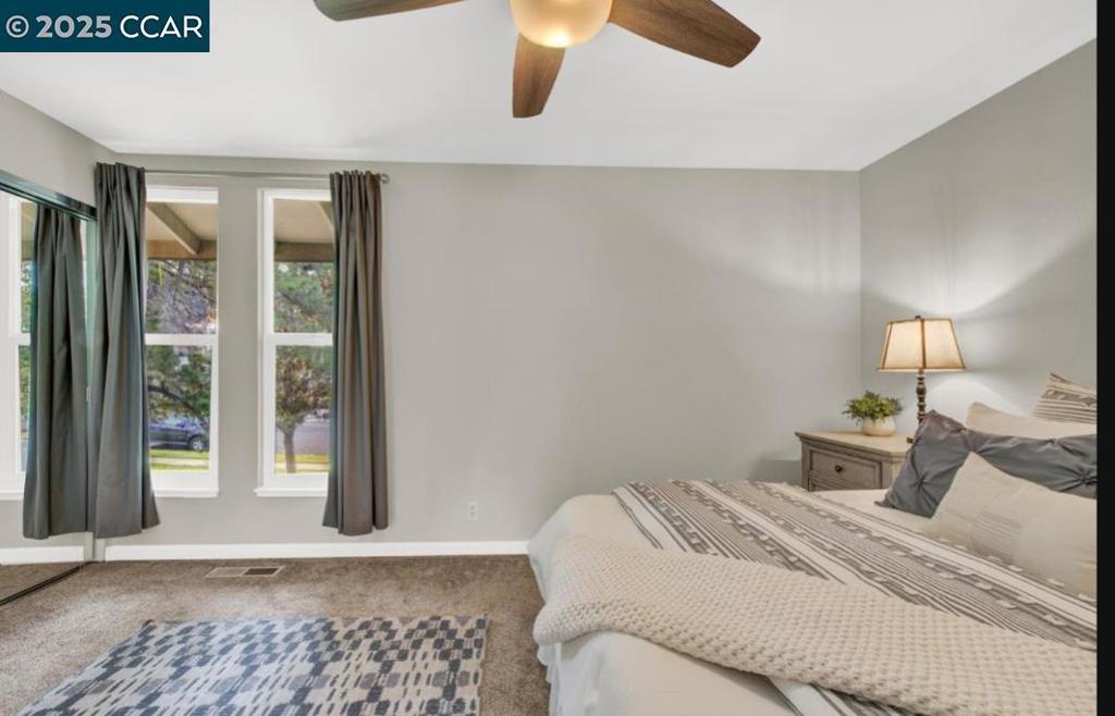 5434 Roundtree Court Concord, CA 94521 - Photo 21 of 23 a bedroom with a bed and window