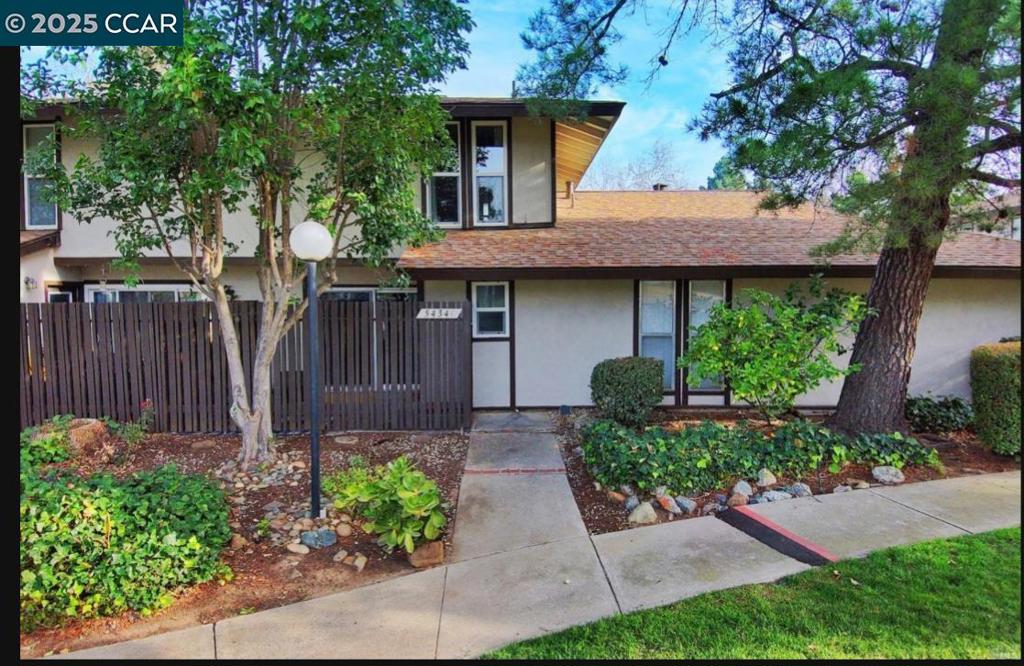 5434 Roundtree Court Concord, CA 94521 - Photo 5 of 23 a front view of a house with garden