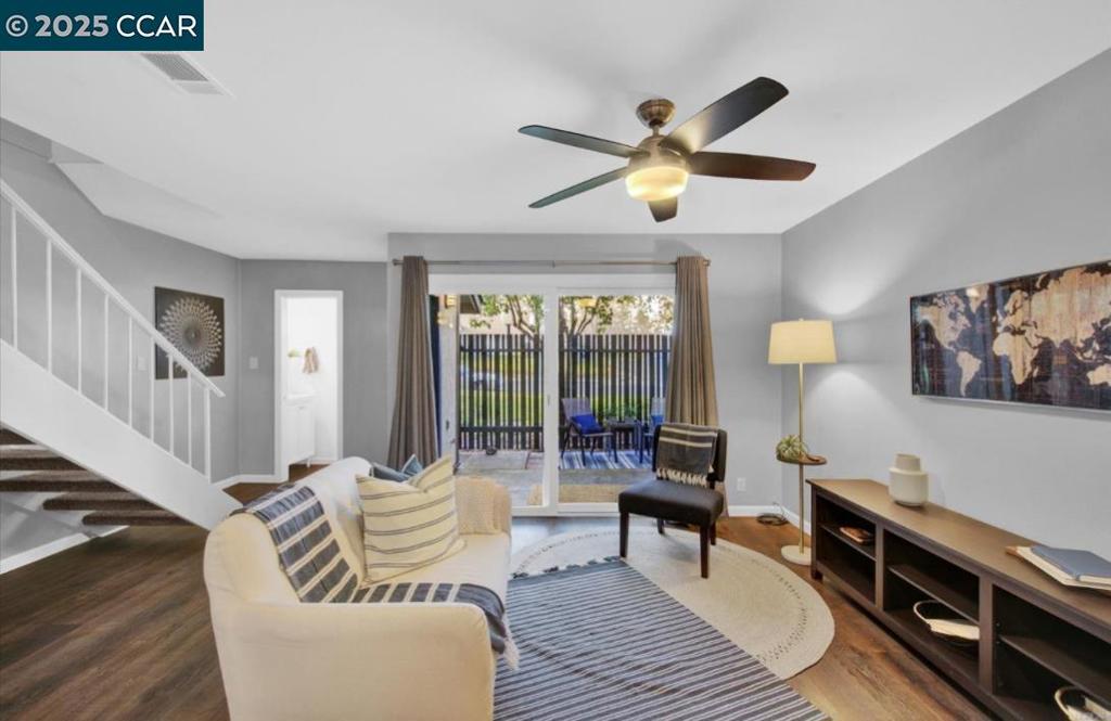 5434 Roundtree Court Concord, CA 94521 - Photo 8 of 23 a living room with furniture and a wooden floor
