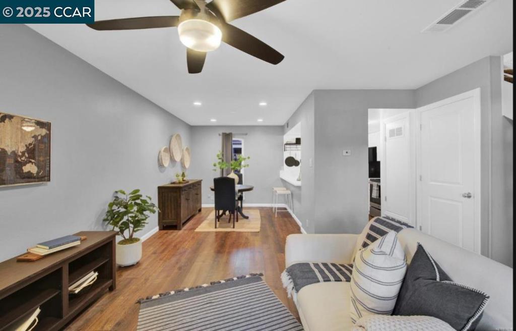 5434 Roundtree Court Concord, CA 94521 - Photo 10 of 23 a living room with furniture and a wooden floor