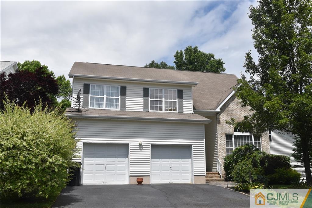 36 Crescent Road Old Bridge, NJ 08857 - Photo 1 of 1 a front view of a house with a garage