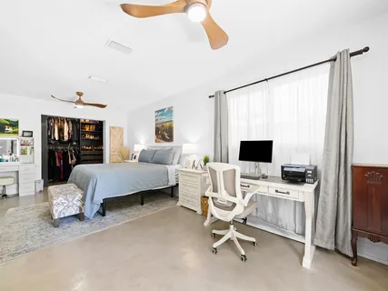 a bedroom with a bed and furniture