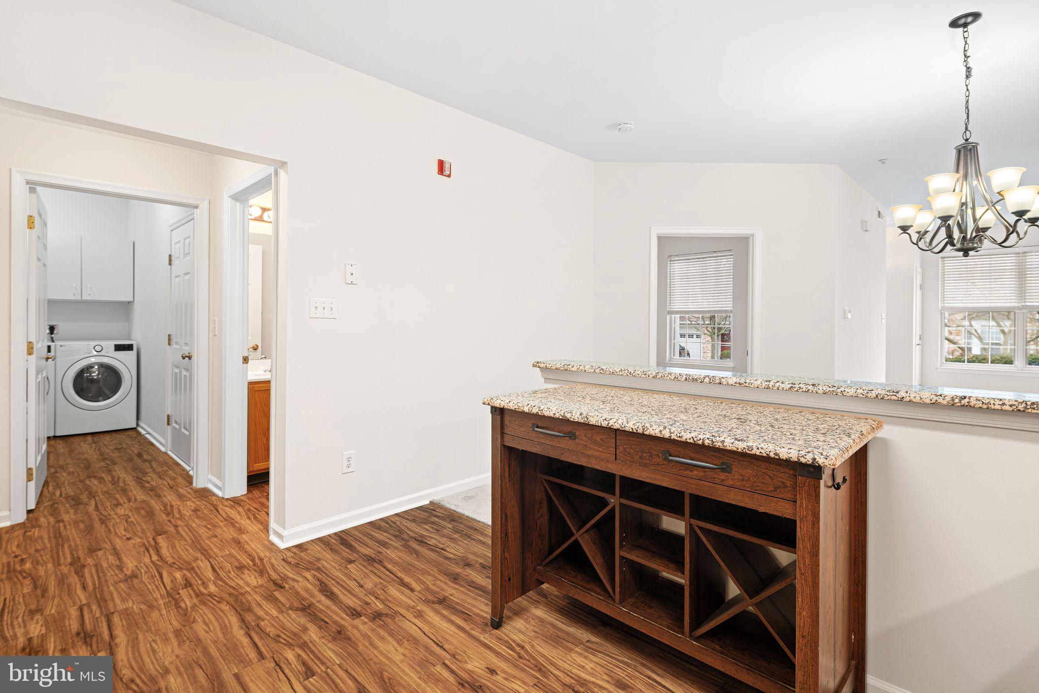 1364 Nicklaus Drive Springfield, PA 19064 - Photo 12 of 25 a kitchen with granite countertop a stove and a wooden floors