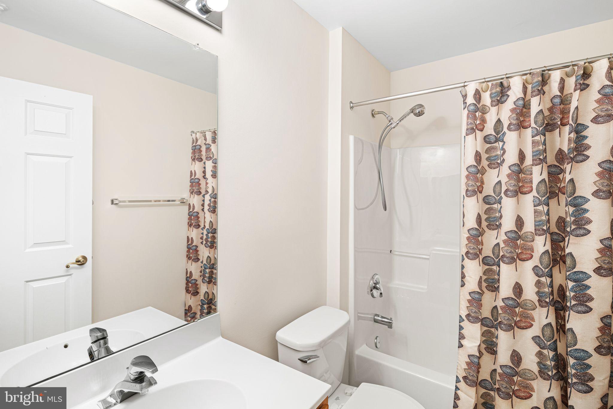 1364 Nicklaus Drive Springfield, PA 19064 - Photo 14 of 25 a bathroom with a sink toilet and shower