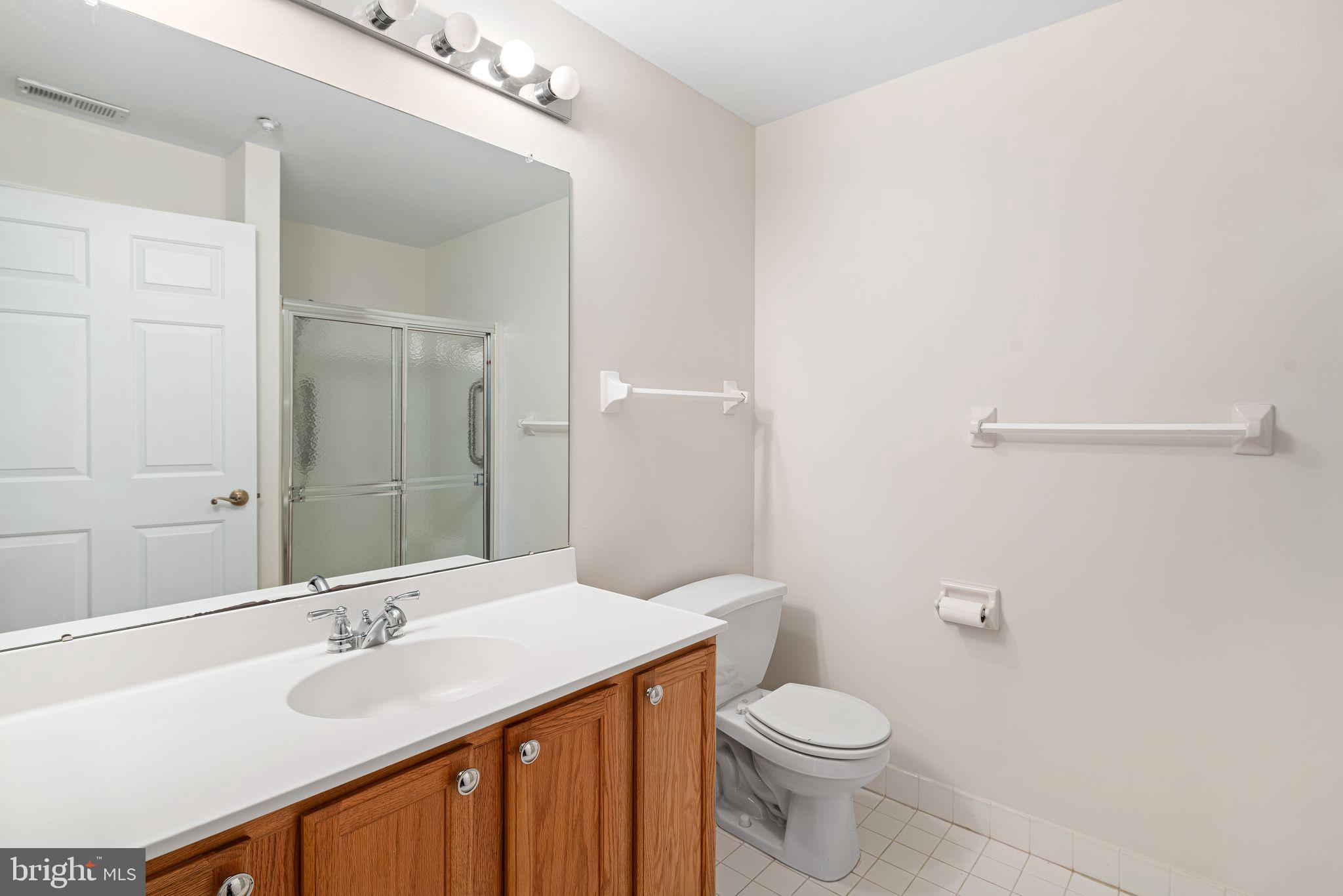 1364 Nicklaus Drive Springfield, PA 19064 - Photo 23 of 25 a bathroom with a sink and a toilet