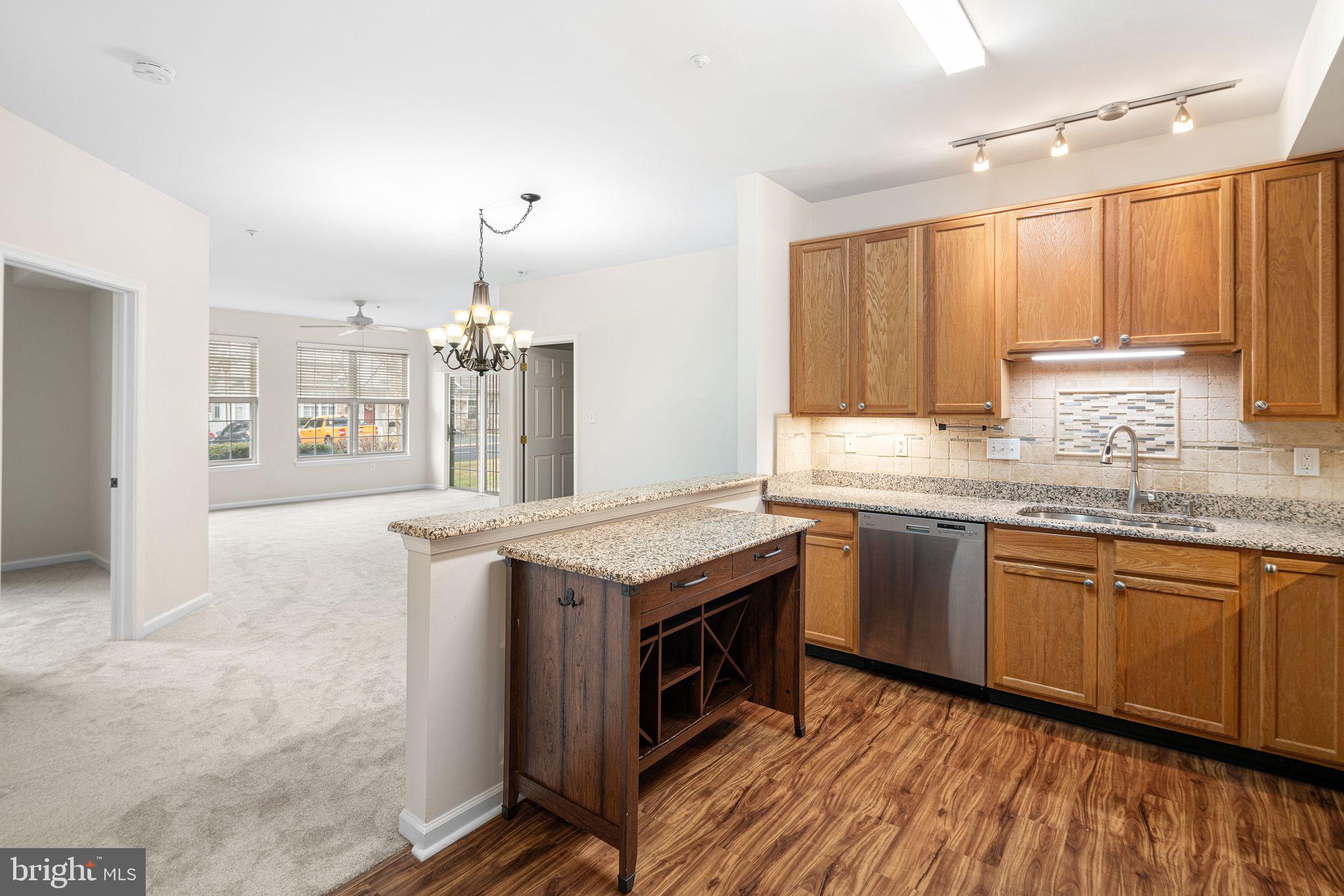 1364 Nicklaus Drive Springfield, PA 19064 - Photo 25 of 25 a kitchen with granite countertop a sink stove and cabinets