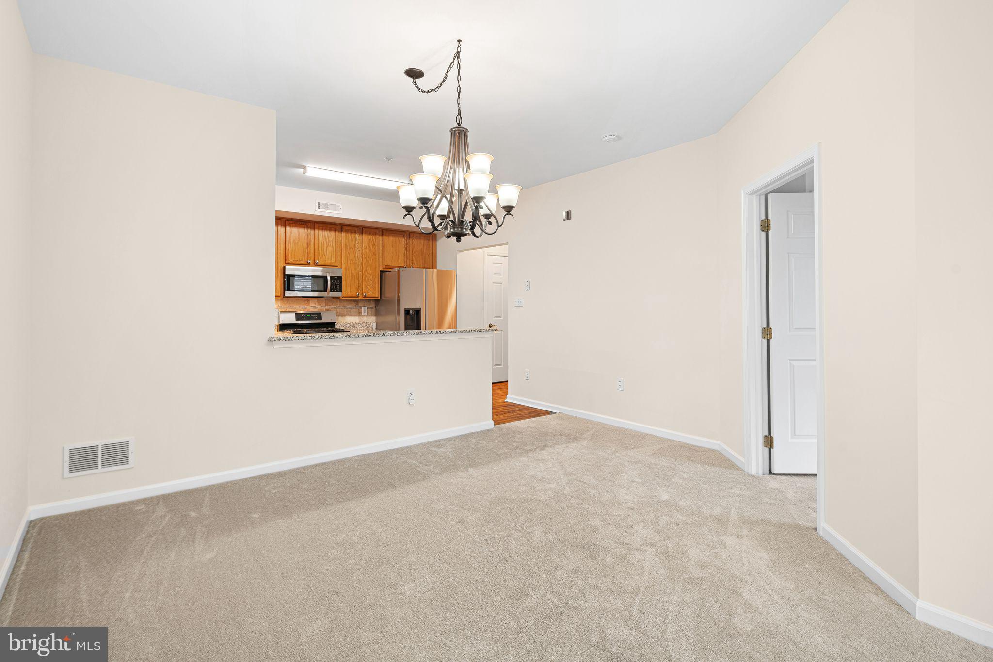 1364 Nicklaus Drive Springfield, PA 19064 - Photo 8 of 25 a view of a kitchen with a sink and chandelier fan
