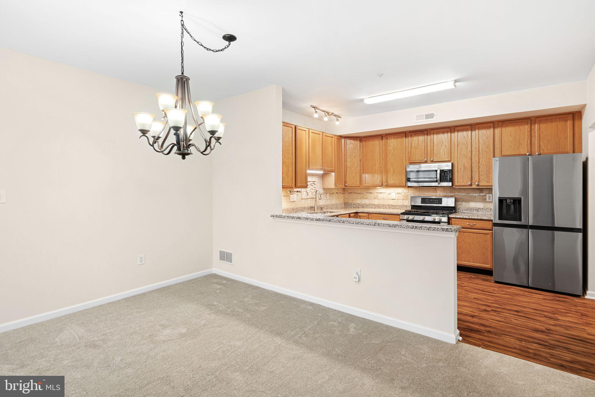 1364 Nicklaus Drive Springfield, PA 19064 - Photo 9 of 25 a kitchen with stainless steel appliances a refrigerator sink and microwave