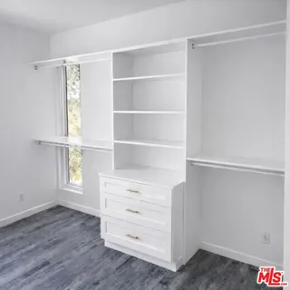 a view of an empty walk in closet