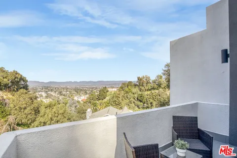 a view of a balcony with an ocean view