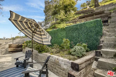 a view of a chairs and table in the patio