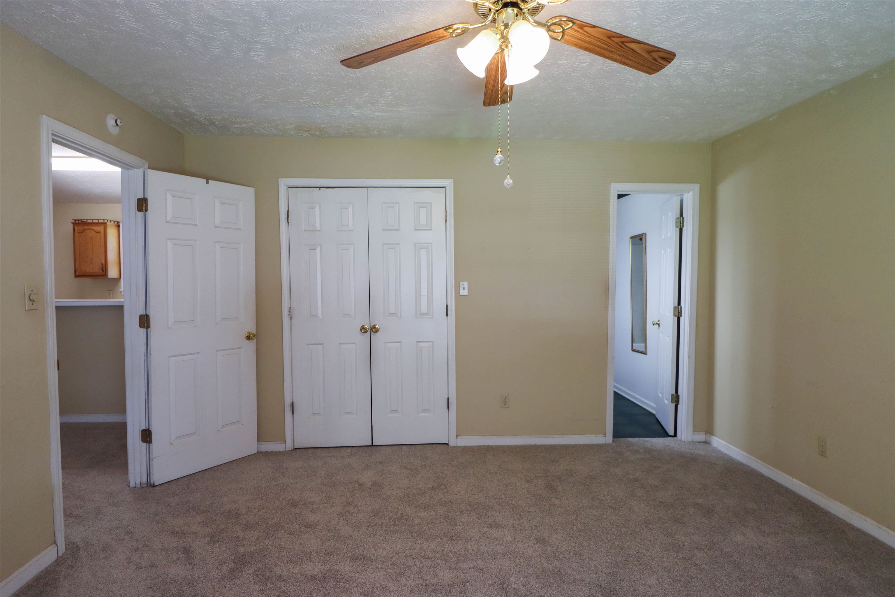 319 Jordan Street Ripley, TN 38063 - Photo 11 of 33 an empty room with windows and fan