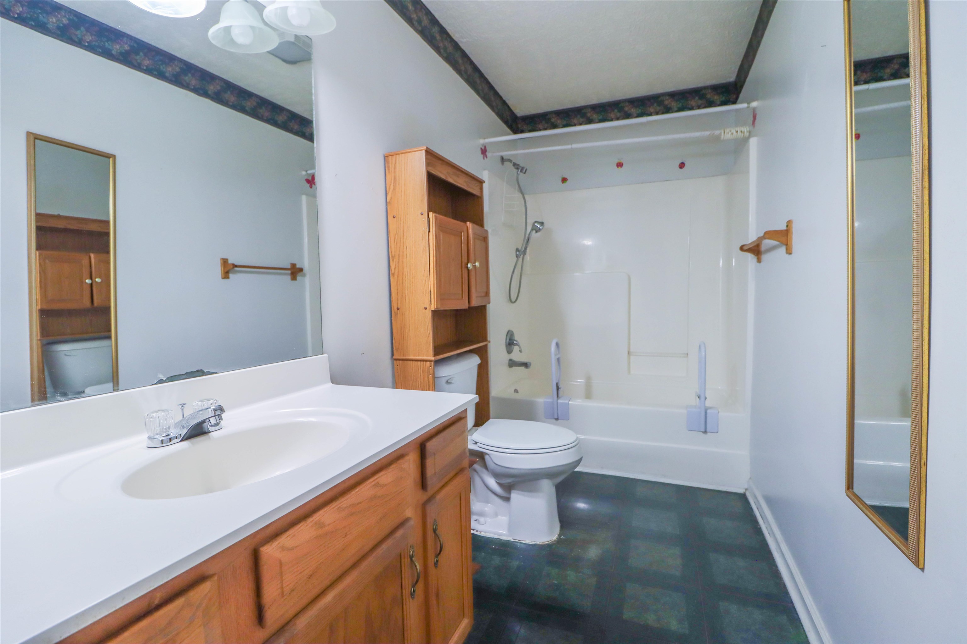319 Jordan Street Ripley, TN 38063 - Photo 12 of 33 a bathroom with a sink toilet a shower and a mirror