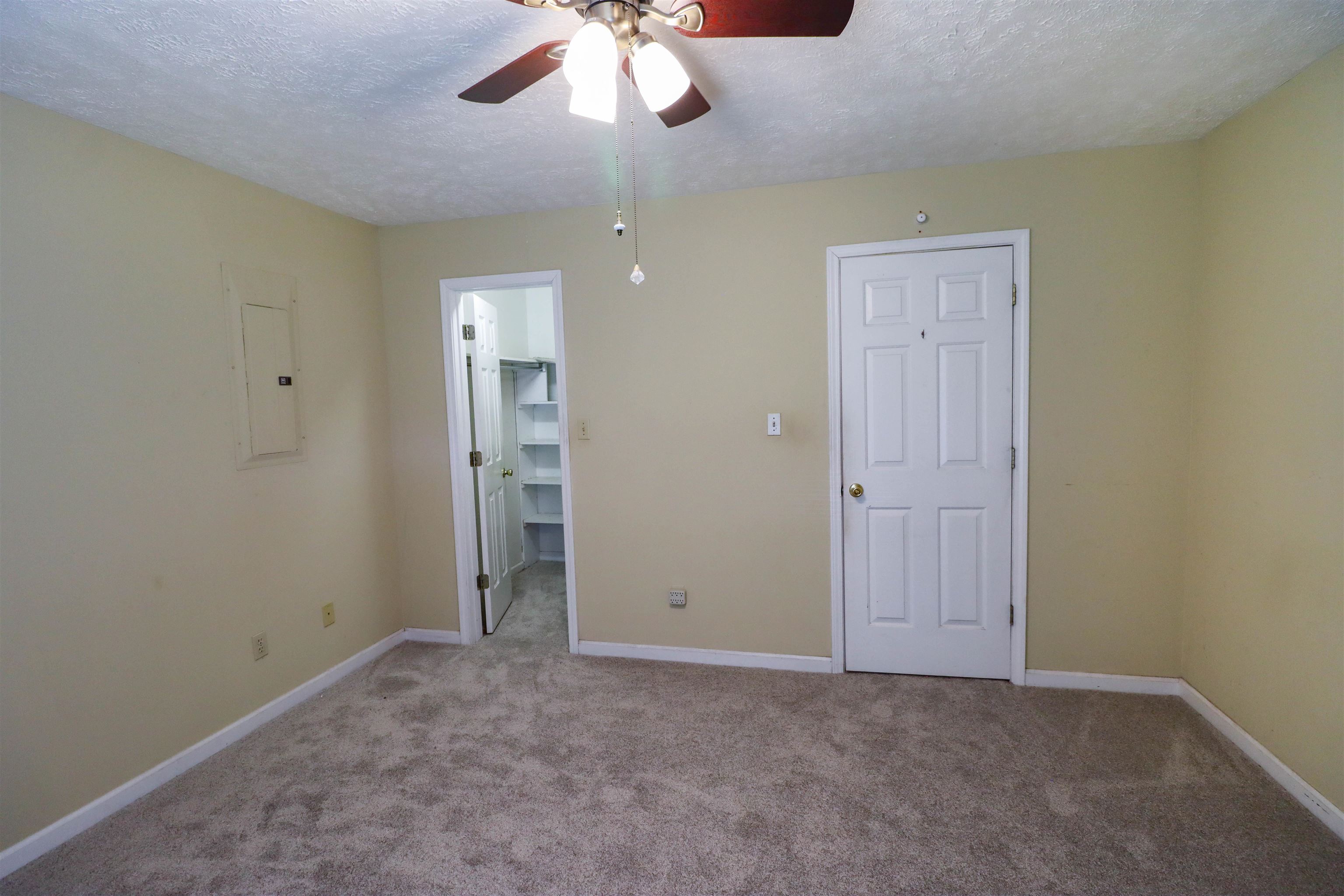319 Jordan Street Ripley, TN 38063 - Photo 16 of 33 a view of an empty room with a chandelier fan
