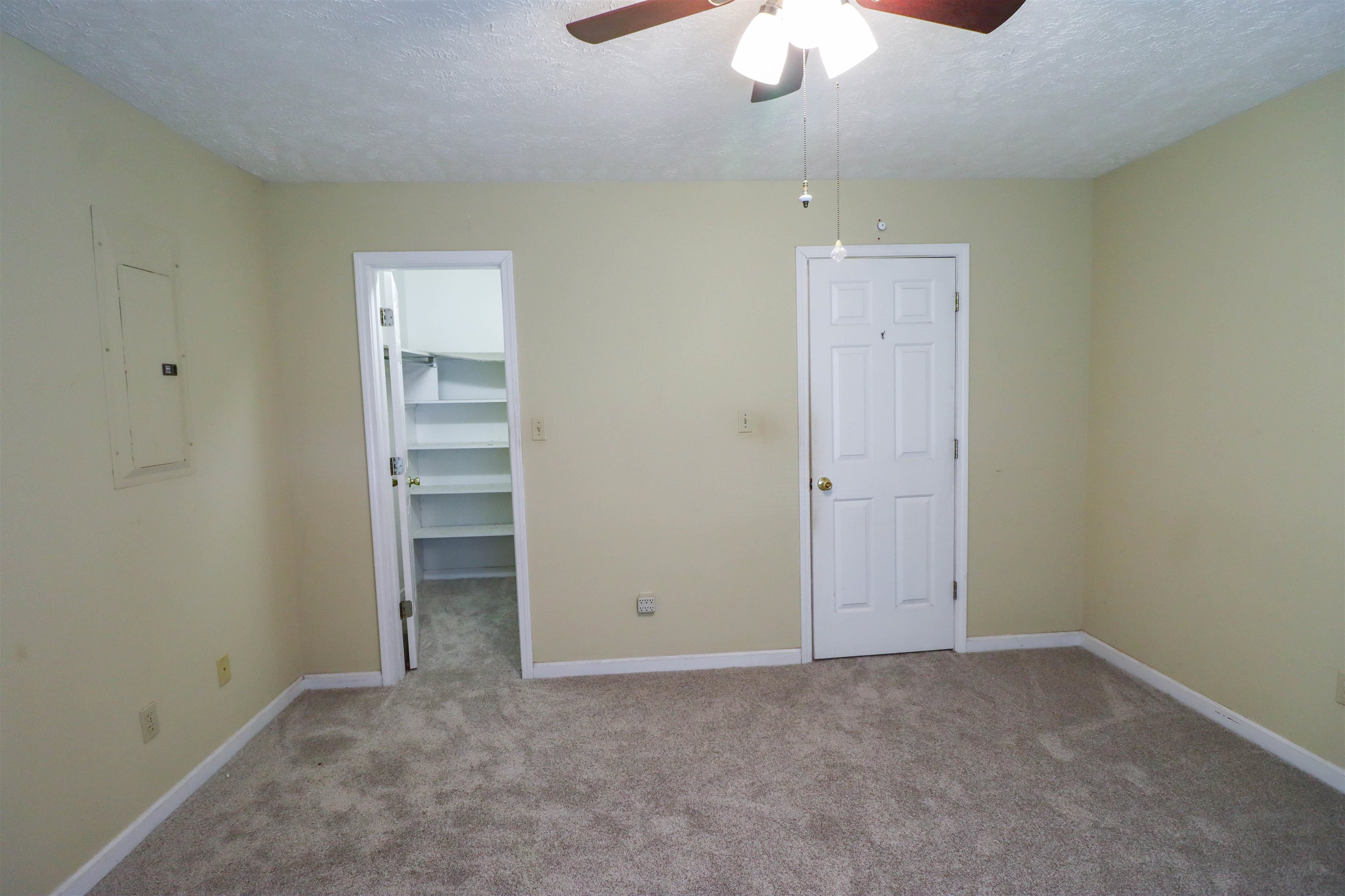 319 Jordan Street Ripley, TN 38063 - Photo 17 of 33 an empty room with a ceiling fan and window