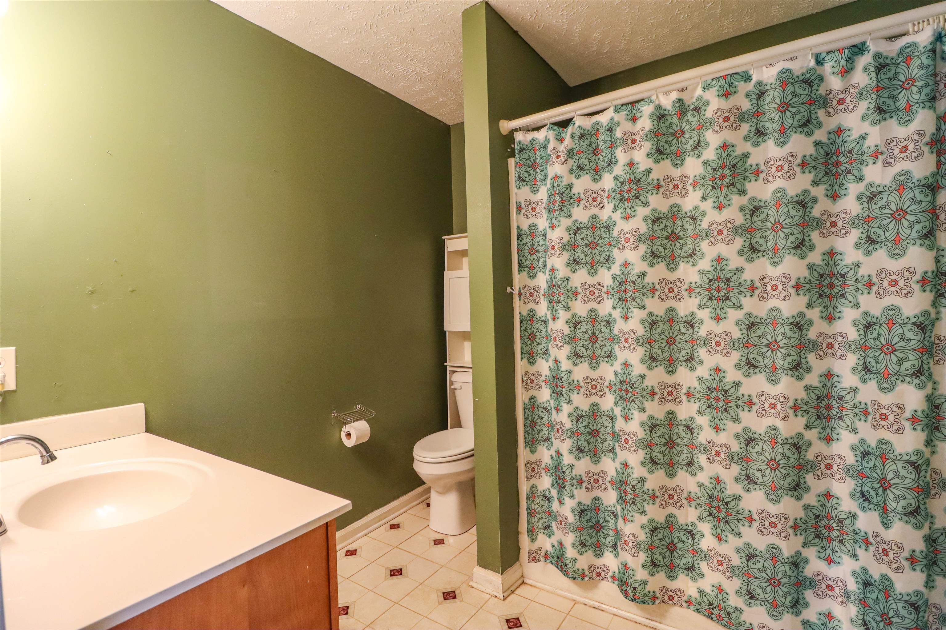 319 Jordan Street Ripley, TN 38063 - Photo 21 of 33 a bathroom with a sink and a toilet