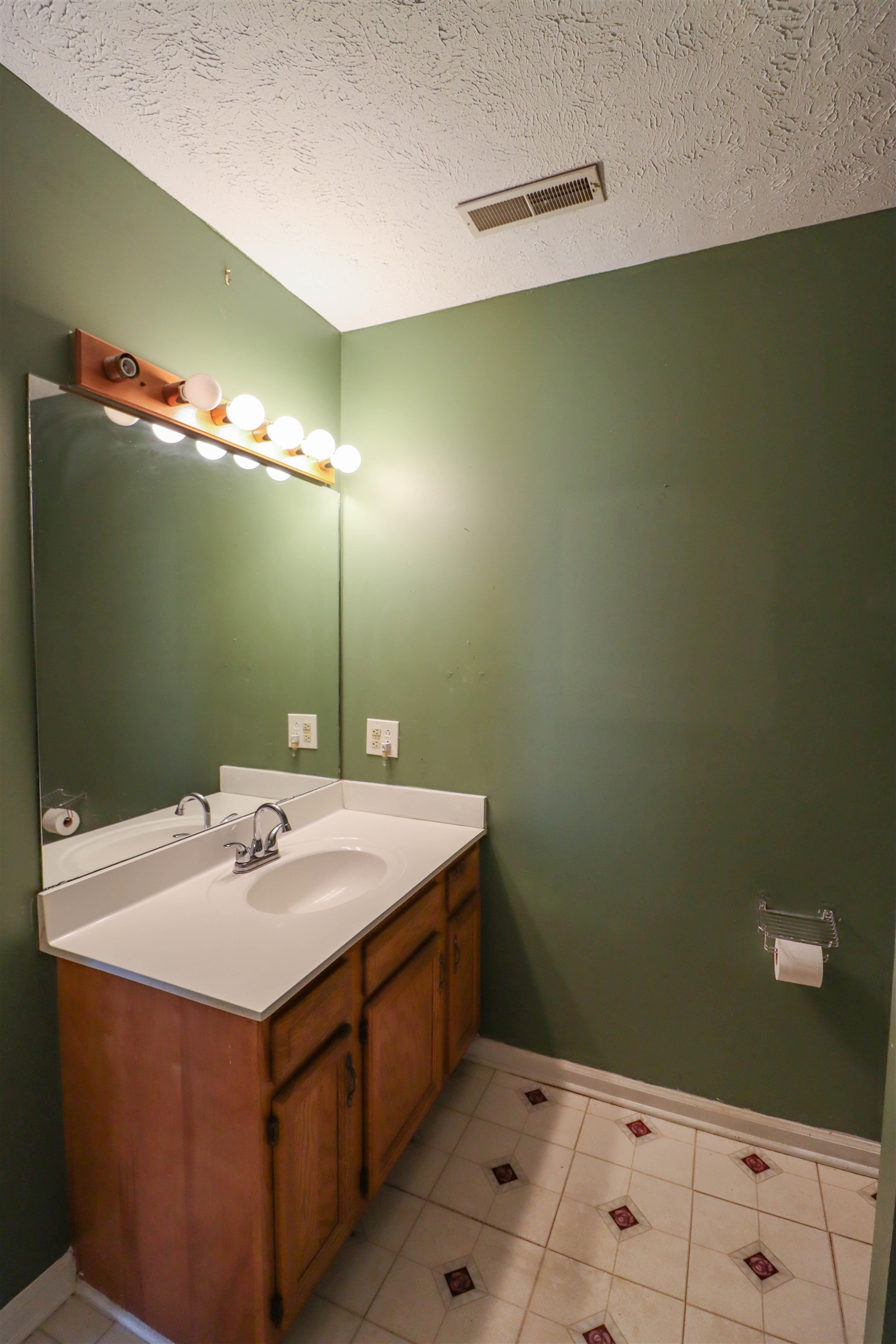 319 Jordan Street Ripley, TN 38063 - Photo 23 of 33 a bathroom with a sink and mirror