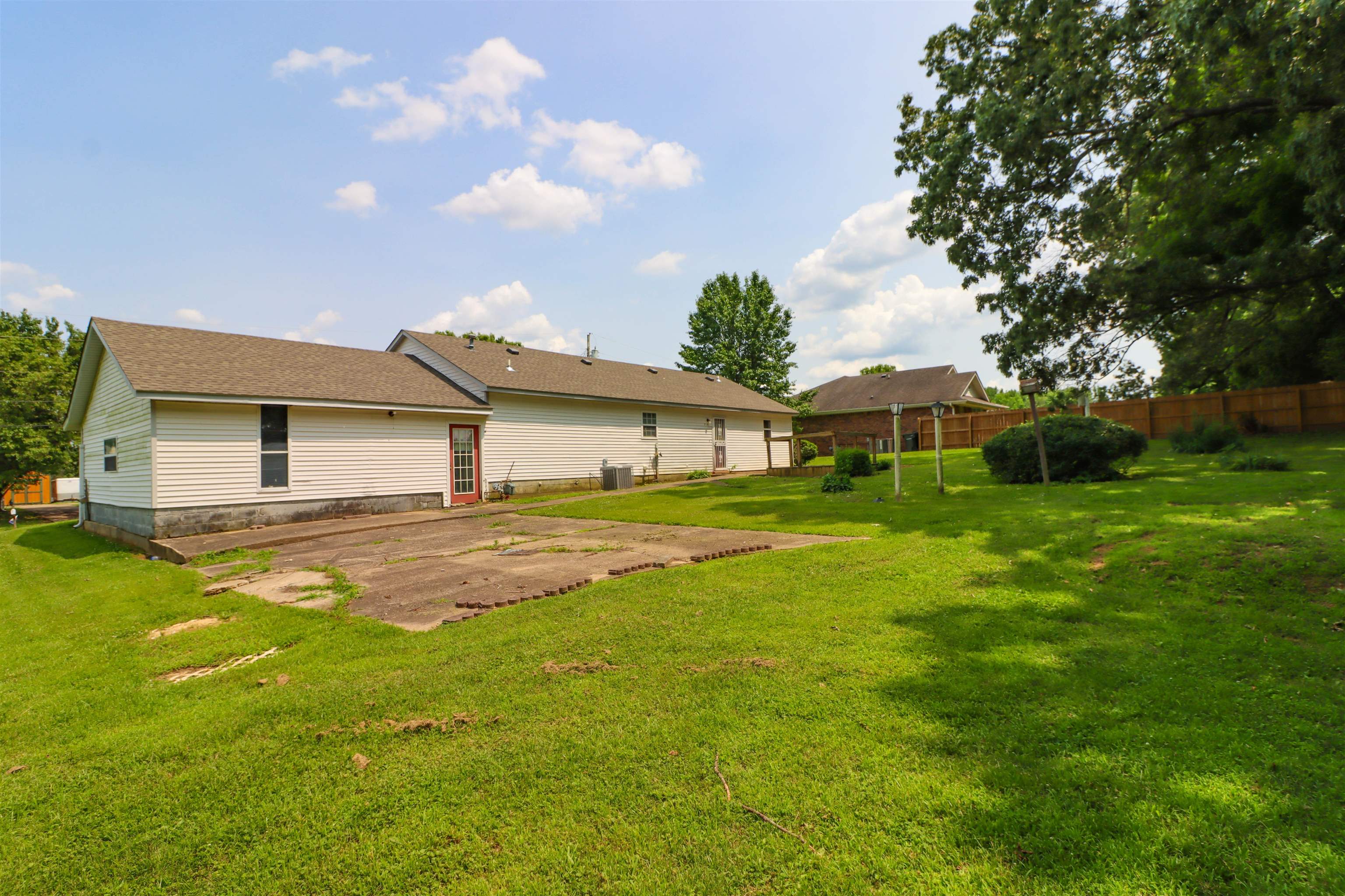 319 Jordan Street Ripley, TN 38063 - Photo 26 of 33 a front view of house with yard and green space