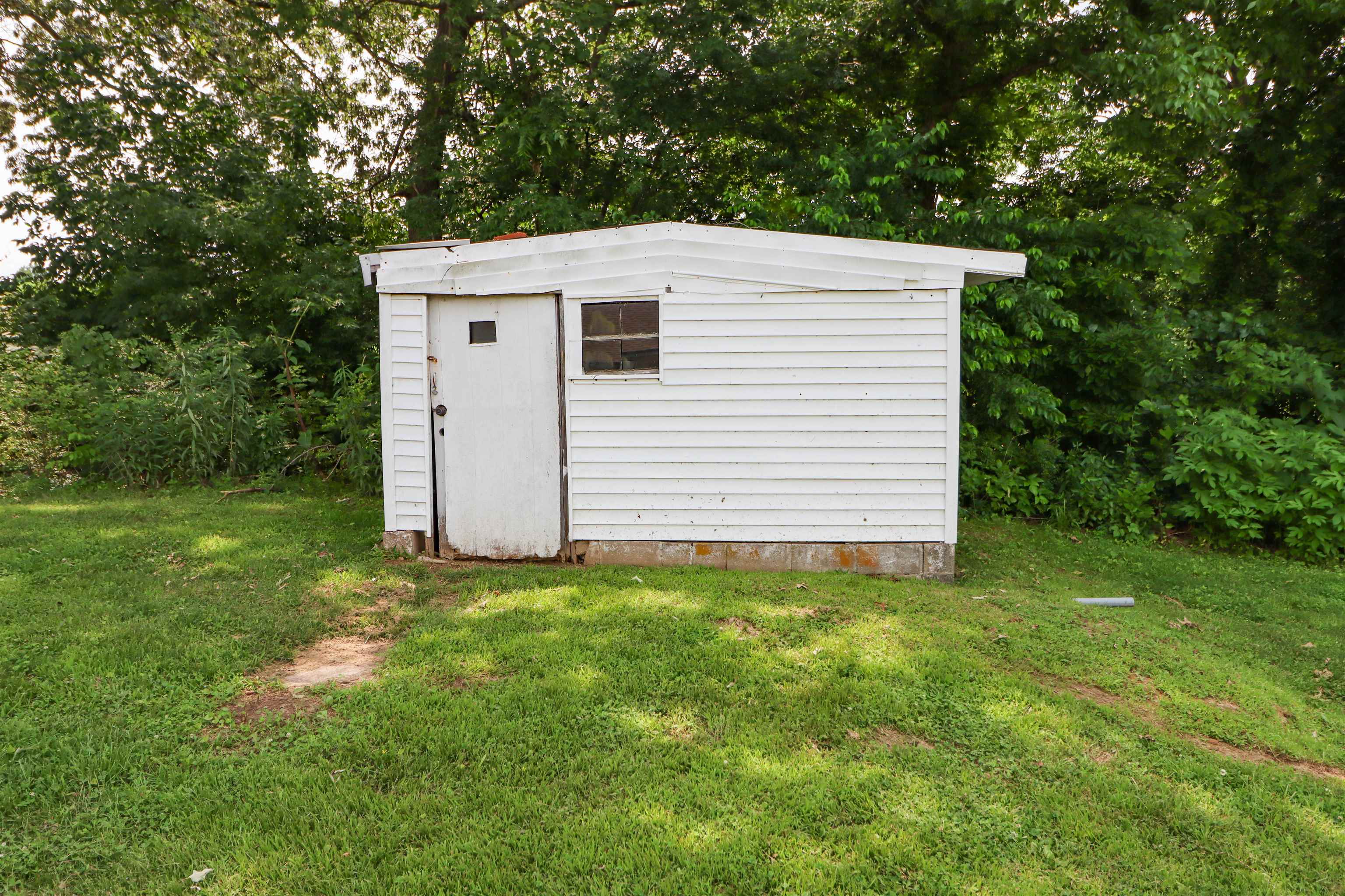 319 Jordan Street Ripley, TN 38063 - Photo 27 of 33 a view of a white house with a yard