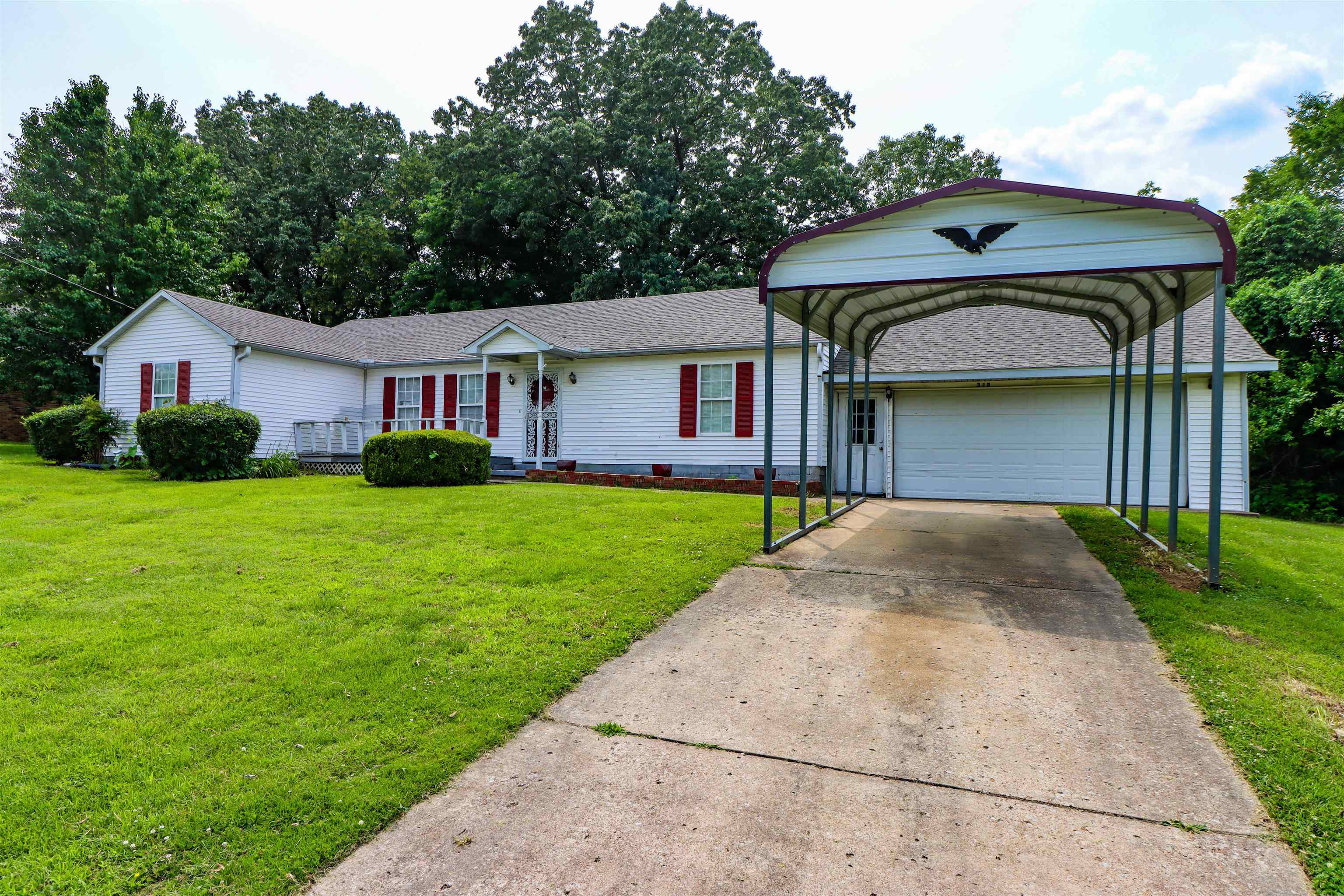319 Jordan Street Ripley, TN 38063 - Photo 32 of 33 a front view of a house with garden