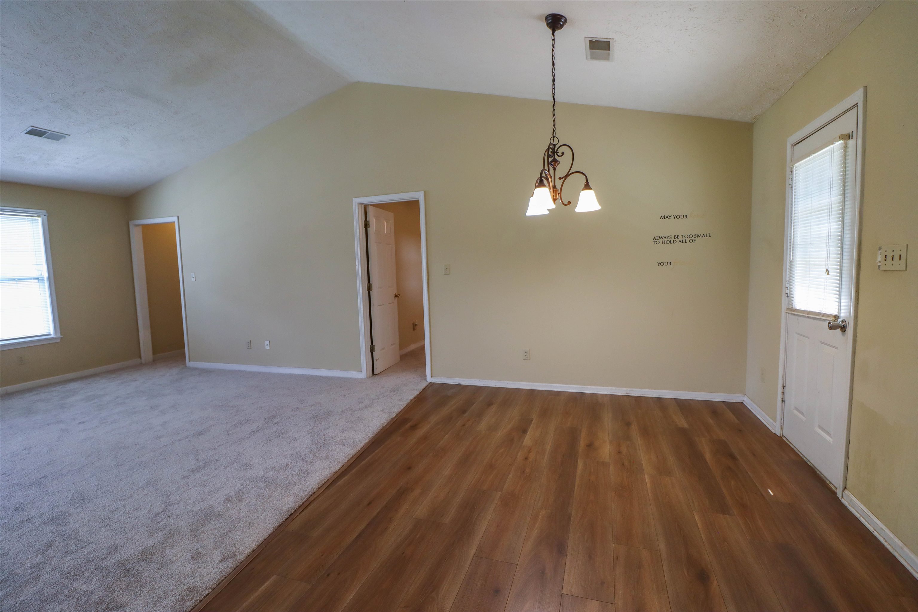 319 Jordan Street Ripley, TN 38063 - Photo 7 of 33 wooden floor in an empty room with a window