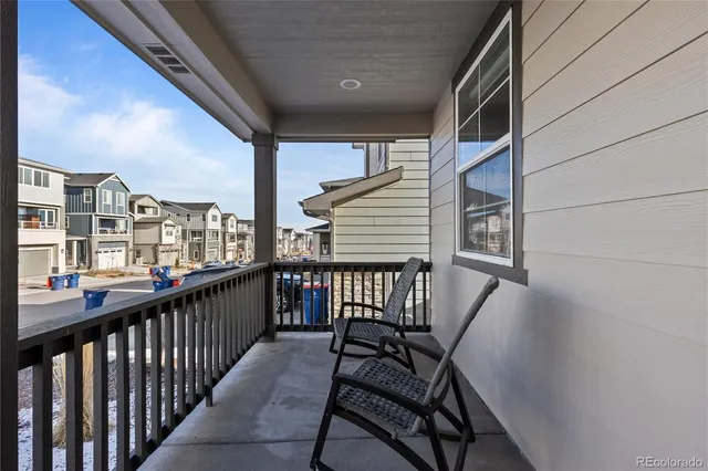 a view of a balcony with furniture