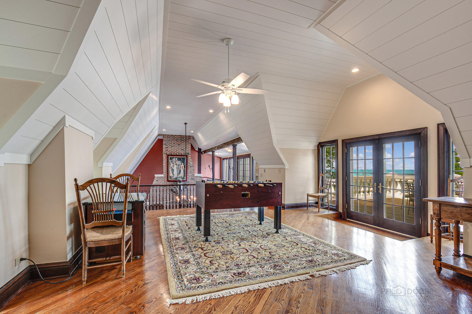 670 Arden Shore Road Lake Bluff, IL 60044 - Photo 16 of 56 a living room with furniture a rug and a chandelier