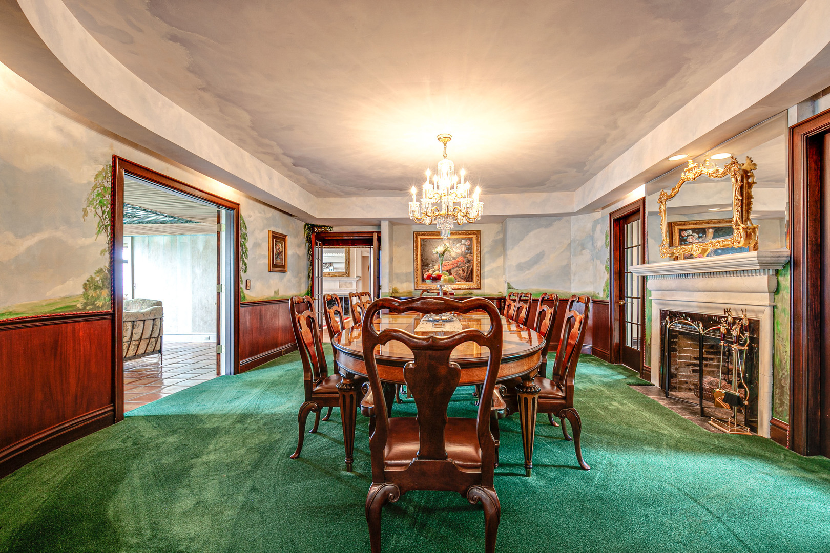670 Arden Shore Road Lake Bluff, IL 60044 - Photo 24 of 56 a dining room with furniture a fireplace and a chandelier
