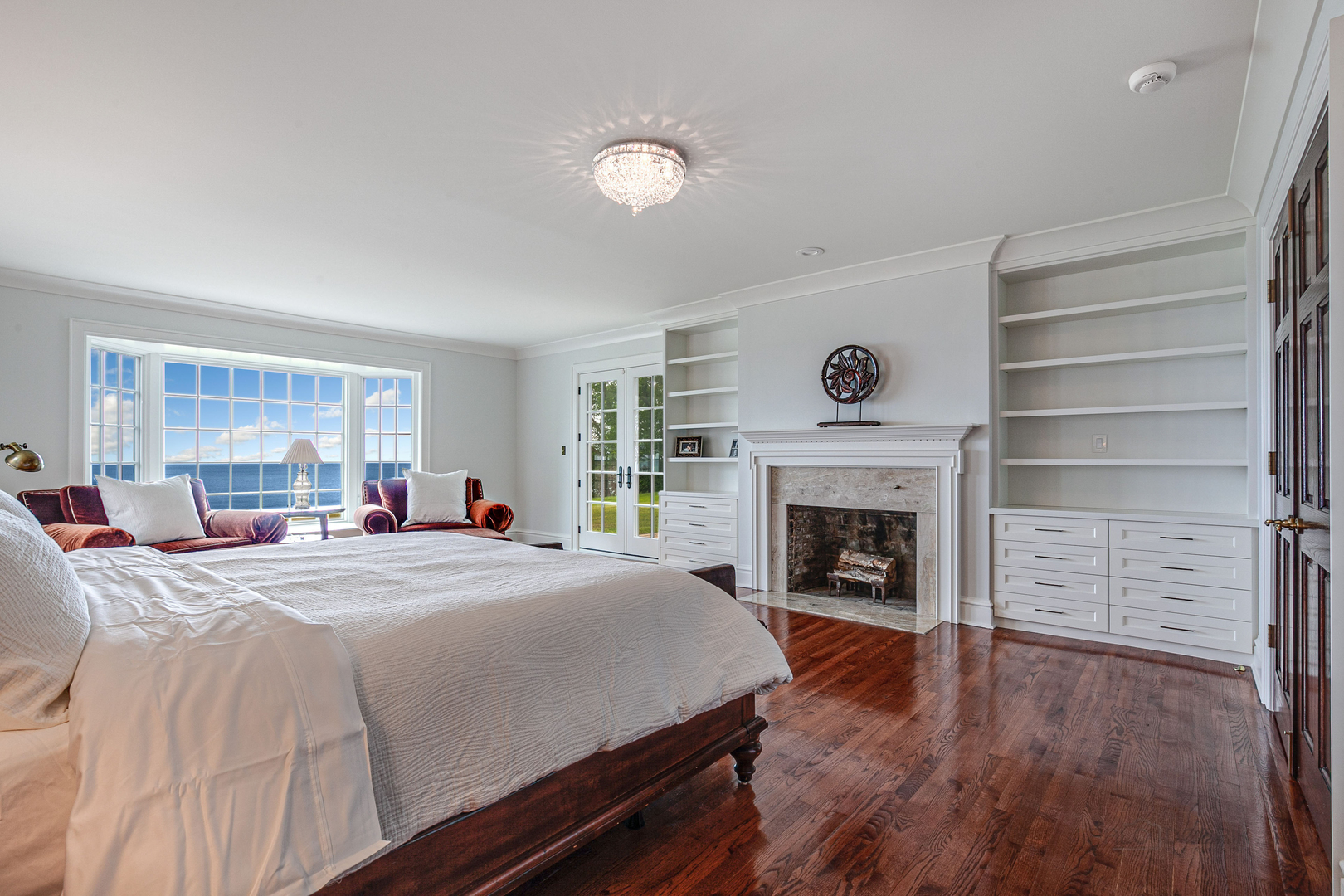 670 Arden Shore Road Lake Bluff, IL 60044 - Photo 26 of 56 a bed room with a fireplace and window