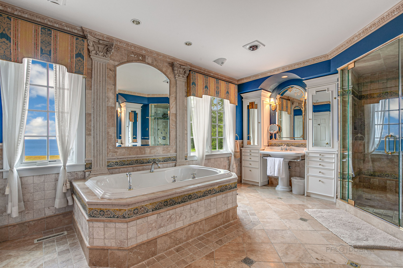 670 Arden Shore Road Lake Bluff, IL 60044 - Photo 29 of 56 a spacious bathroom with a tub and a large mirror