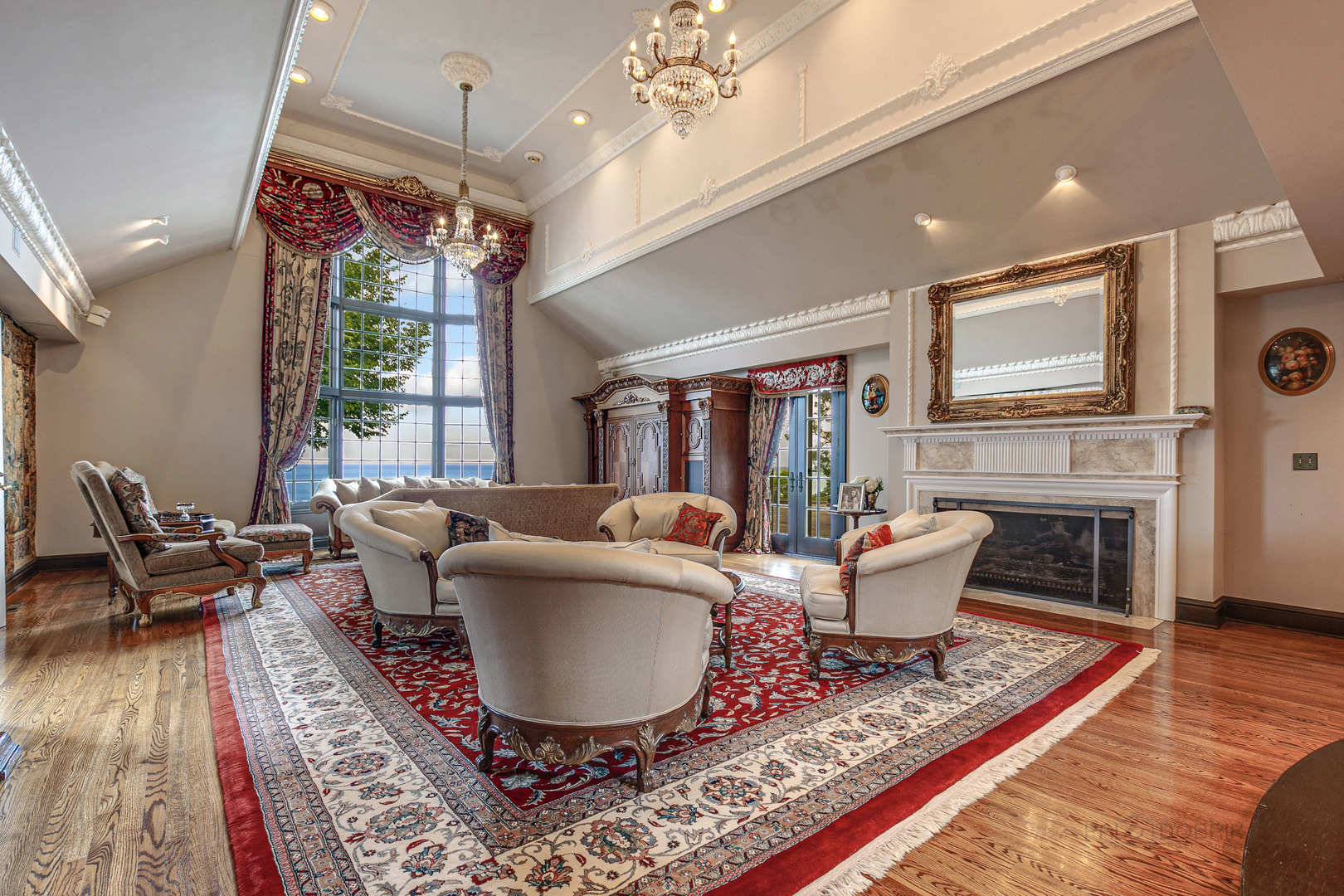 670 Arden Shore Road Lake Bluff, IL 60044 - Photo 5 of 56 a living room with furniture a fireplace and a chandelier