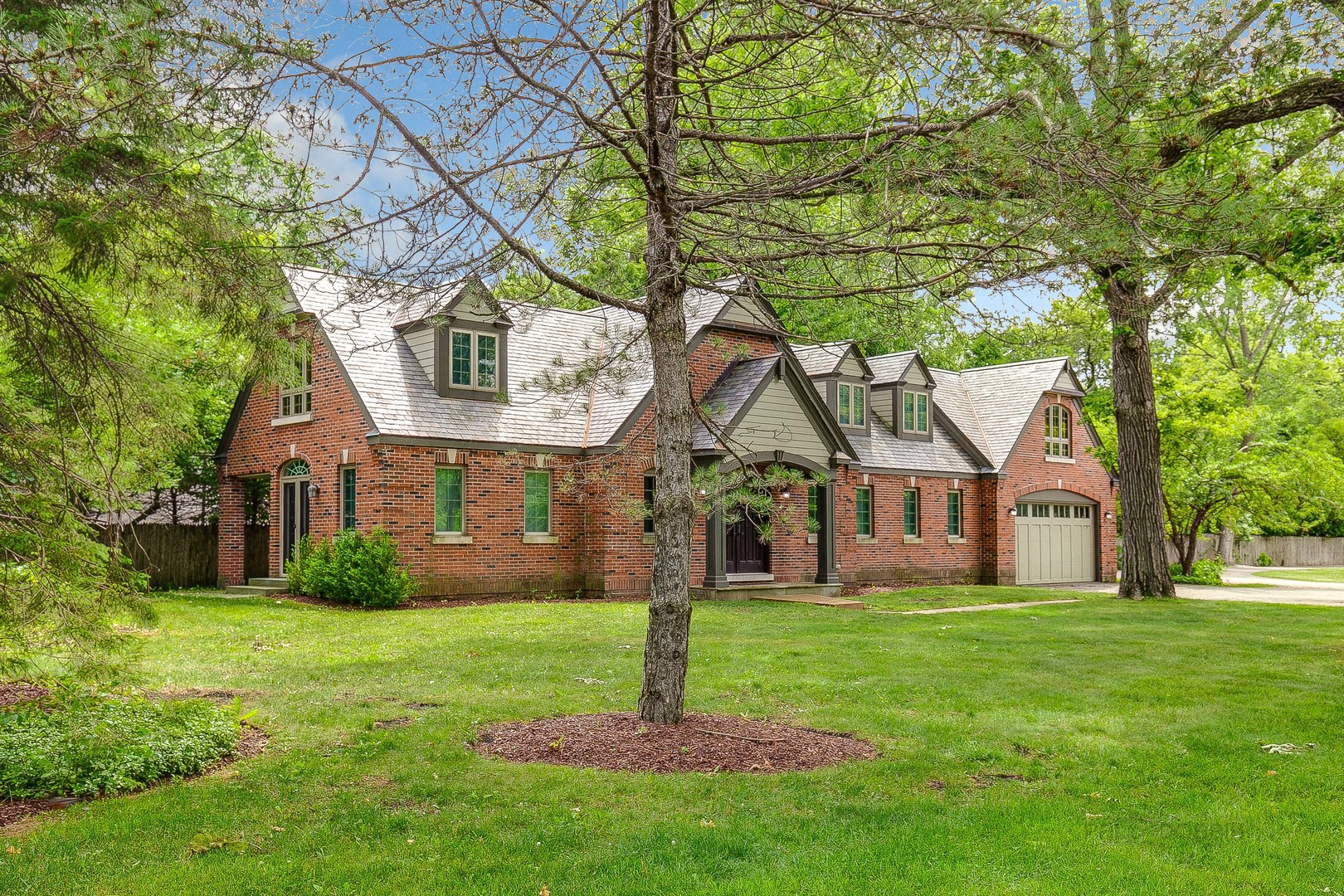 670 Arden Shore Road Lake Bluff, IL 60044 - Photo 49 of 56 a front view of a house with garden