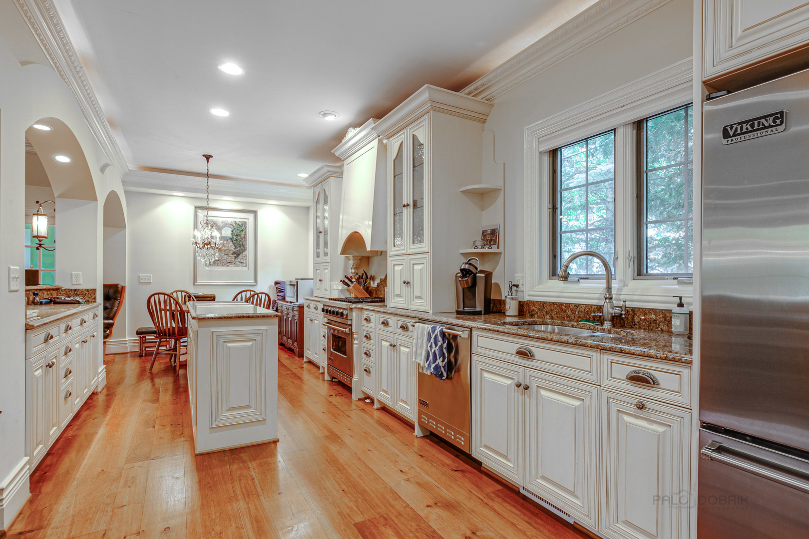 670 Arden Shore Road Lake Bluff, IL 60044 - Photo 51 of 56 a large kitchen with stainless steel appliances a lot of counter space and a wooden floor