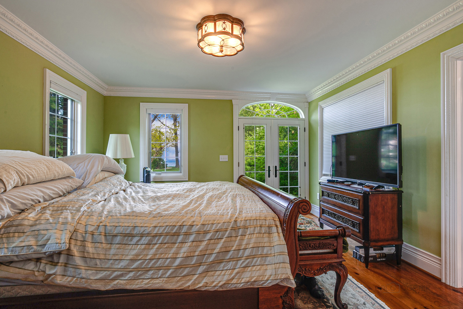 670 Arden Shore Road Lake Bluff, IL 60044 - Photo 53 of 56 a bedroom with a bed and a flat screen tv