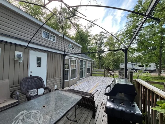 a view of backyard with outdoor seating and plants