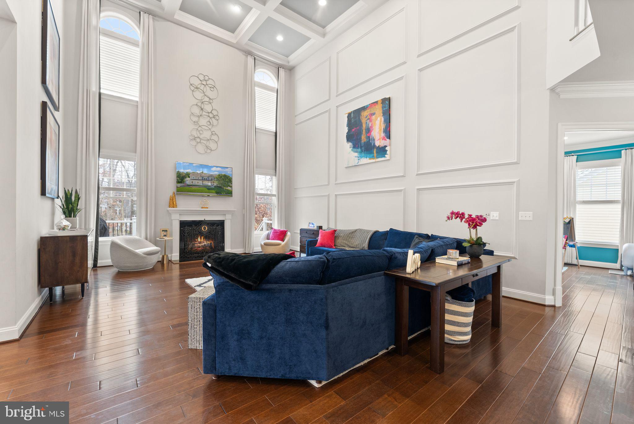 41865 Paddock Gate Place Ashburn, VA 20148 - Photo 17 of 99 a living room with furniture a fireplace and wooden floor