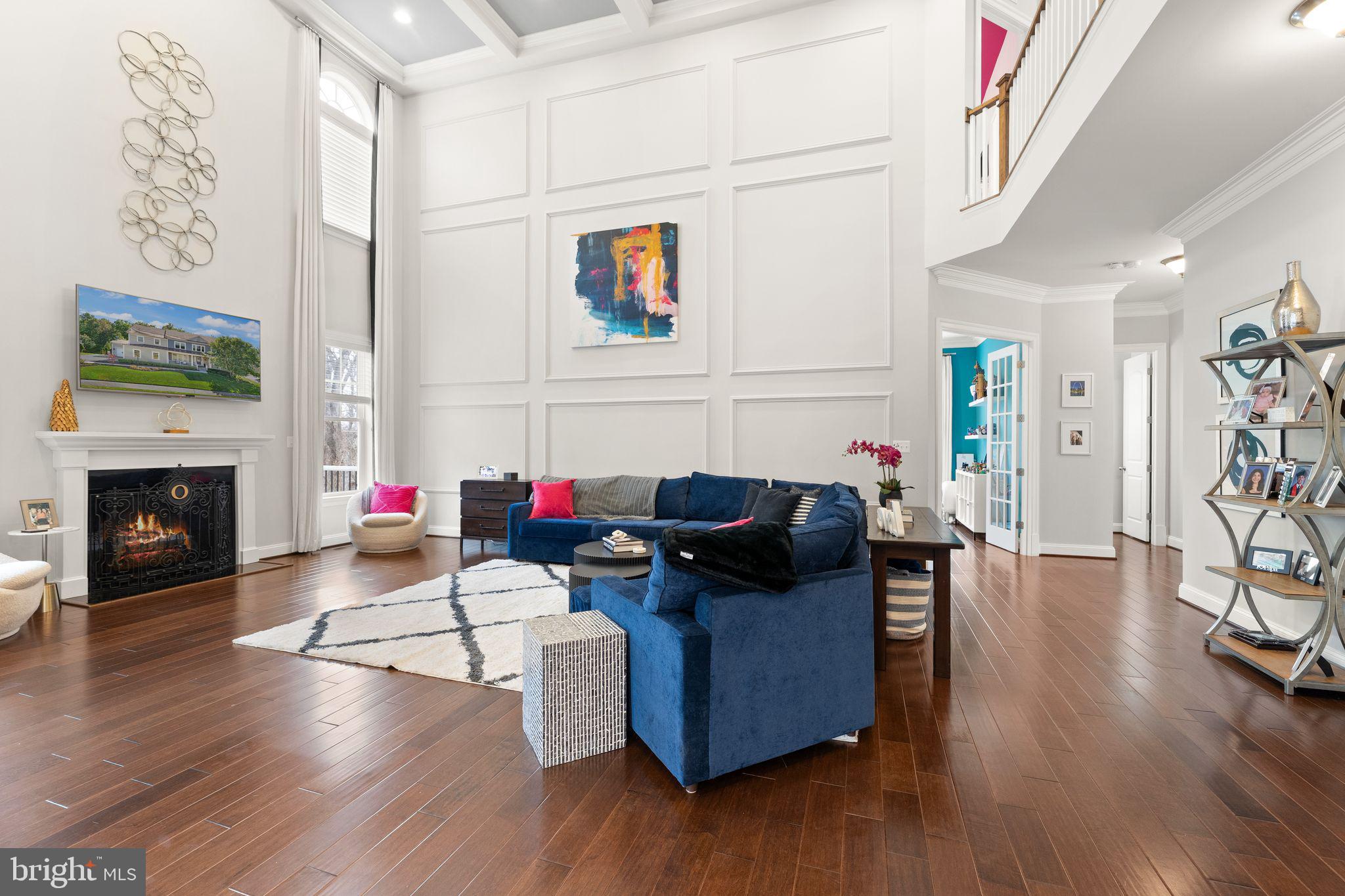 41865 Paddock Gate Place Ashburn, VA 20148 - Photo 19 of 99 a living room with furniture and a fireplace
