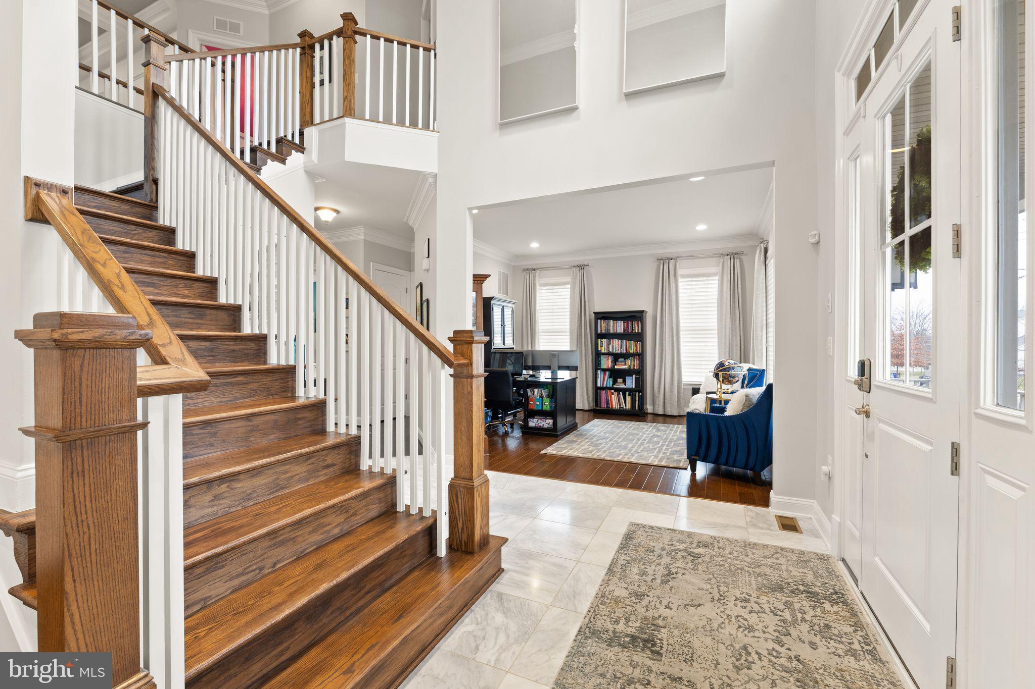 41865 Paddock Gate Place Ashburn, VA 20148 - Photo 23 of 99 a view of entryway and hall with wooden floor