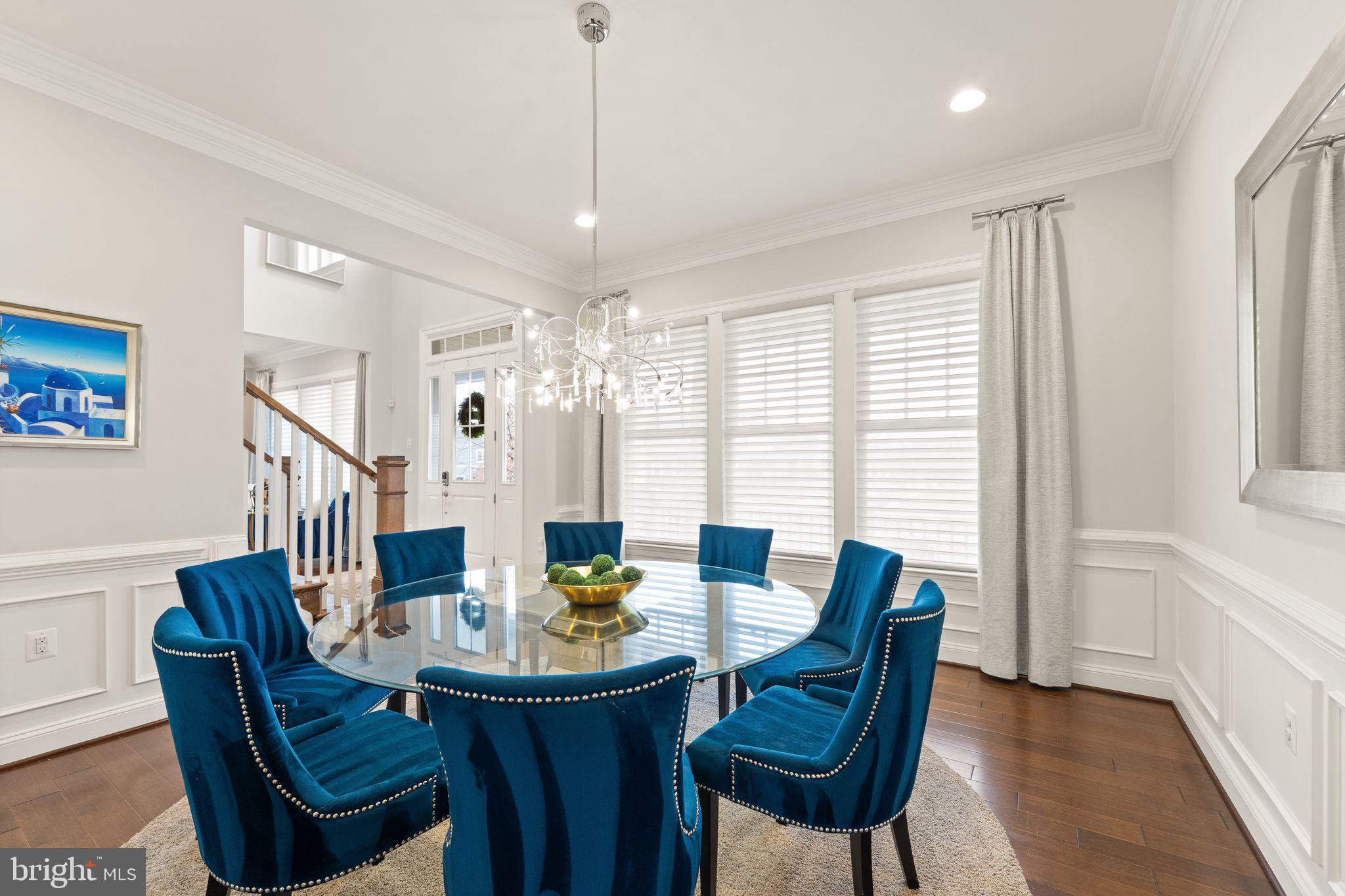 41865 Paddock Gate Place Ashburn, VA 20148 - Photo 27 of 99 a view of a dining room with furniture window and wooden floor