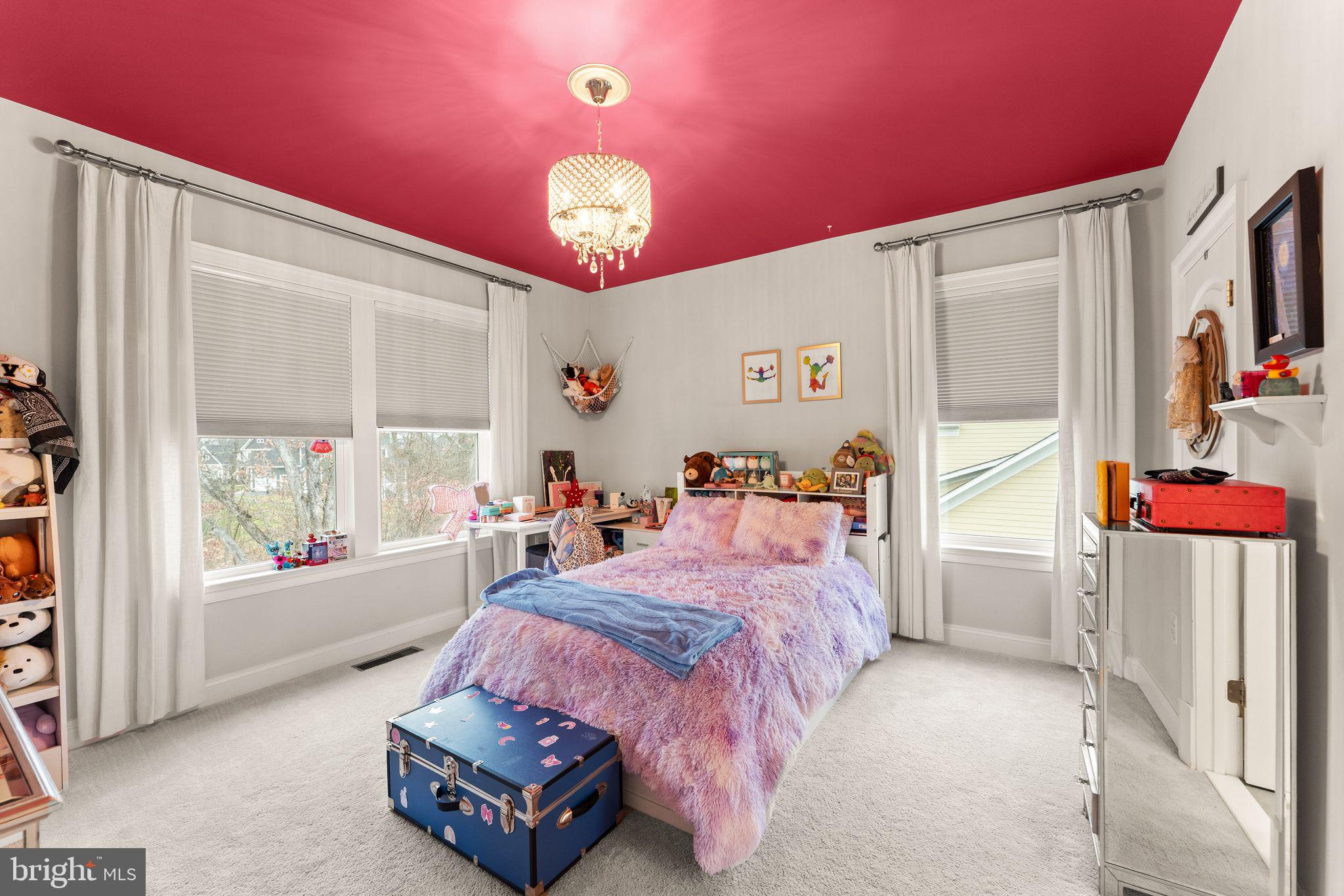 41865 Paddock Gate Place Ashburn, VA 20148 - Photo 52 of 99 a bedroom with a bed and a large window with the outdoor space