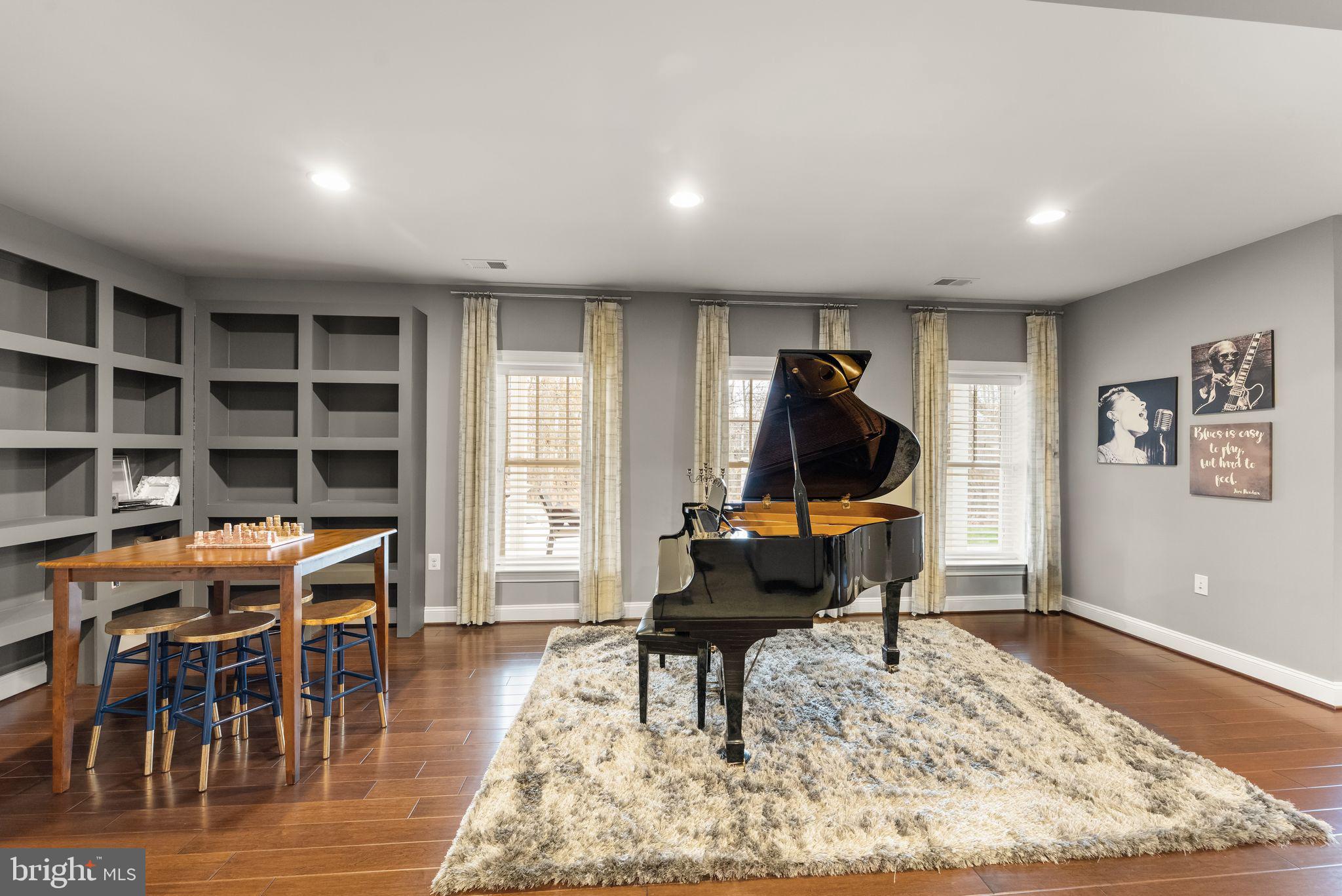 41865 Paddock Gate Place Ashburn, VA 20148 - Photo 61 of 99 a living room with furniture a rug and a window