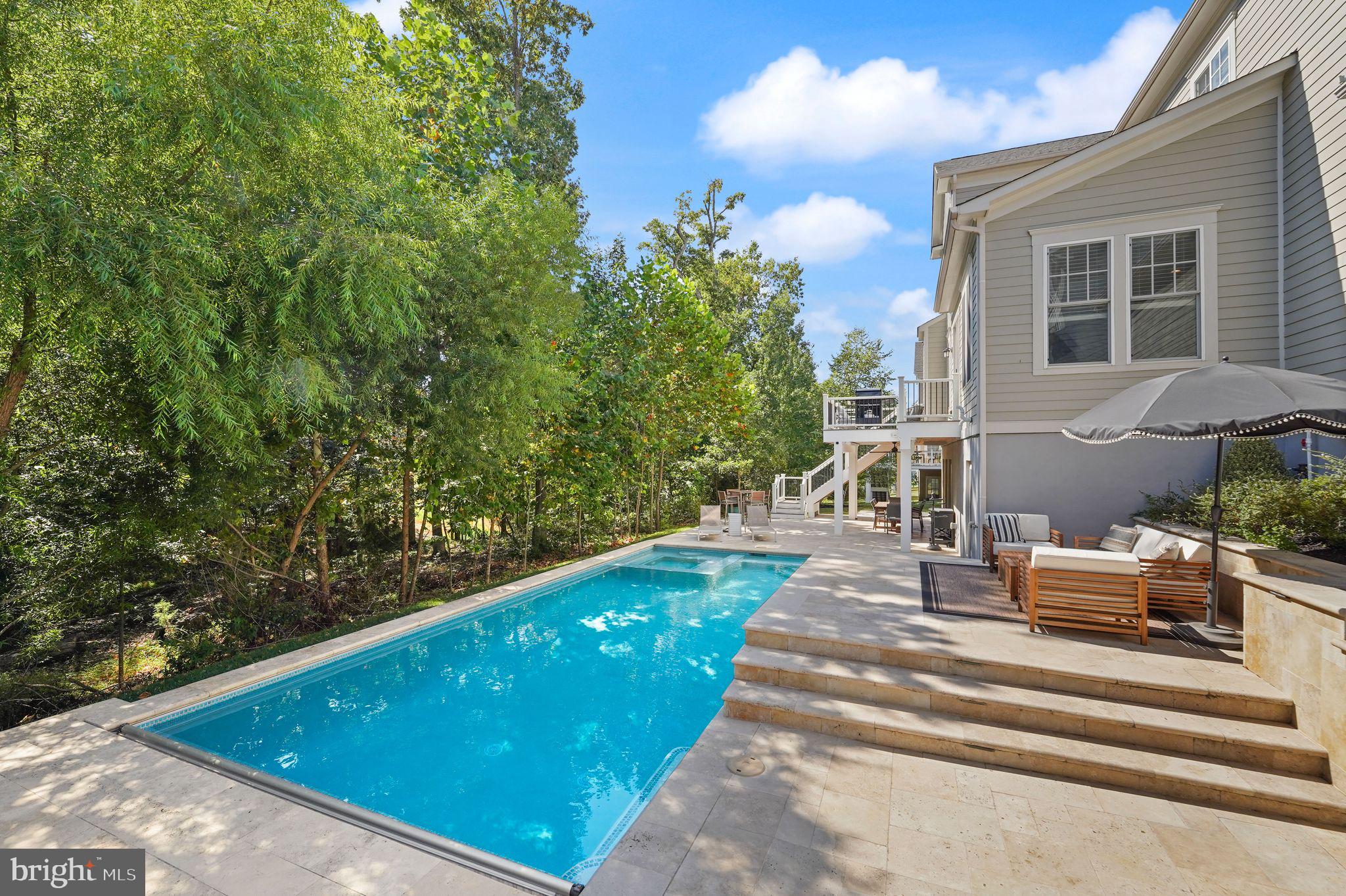 41865 Paddock Gate Place Ashburn, VA 20148 - Photo 77 of 99 a view of patio with table and chairs and potted plants