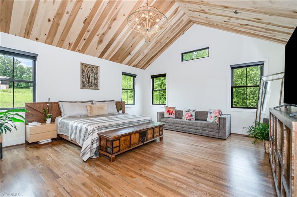 2519 Rivers Edge Road Summerfield, NC 27358 - Photo 15 of 42 Primary bedroom with vaulted ceilings